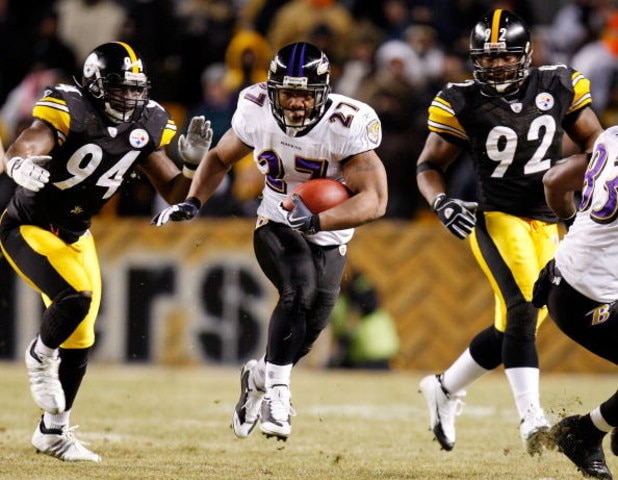 PITTSBURGH - JANUARY 18:  Running back Ray Rice #27 of the Baltimore Ravens runs the ball against linebacker linebackers Lawrence Timmons #94 and James Harrison #92 of the Pittsburgh Steelers during the second quarter of the AFC championship game on Janua