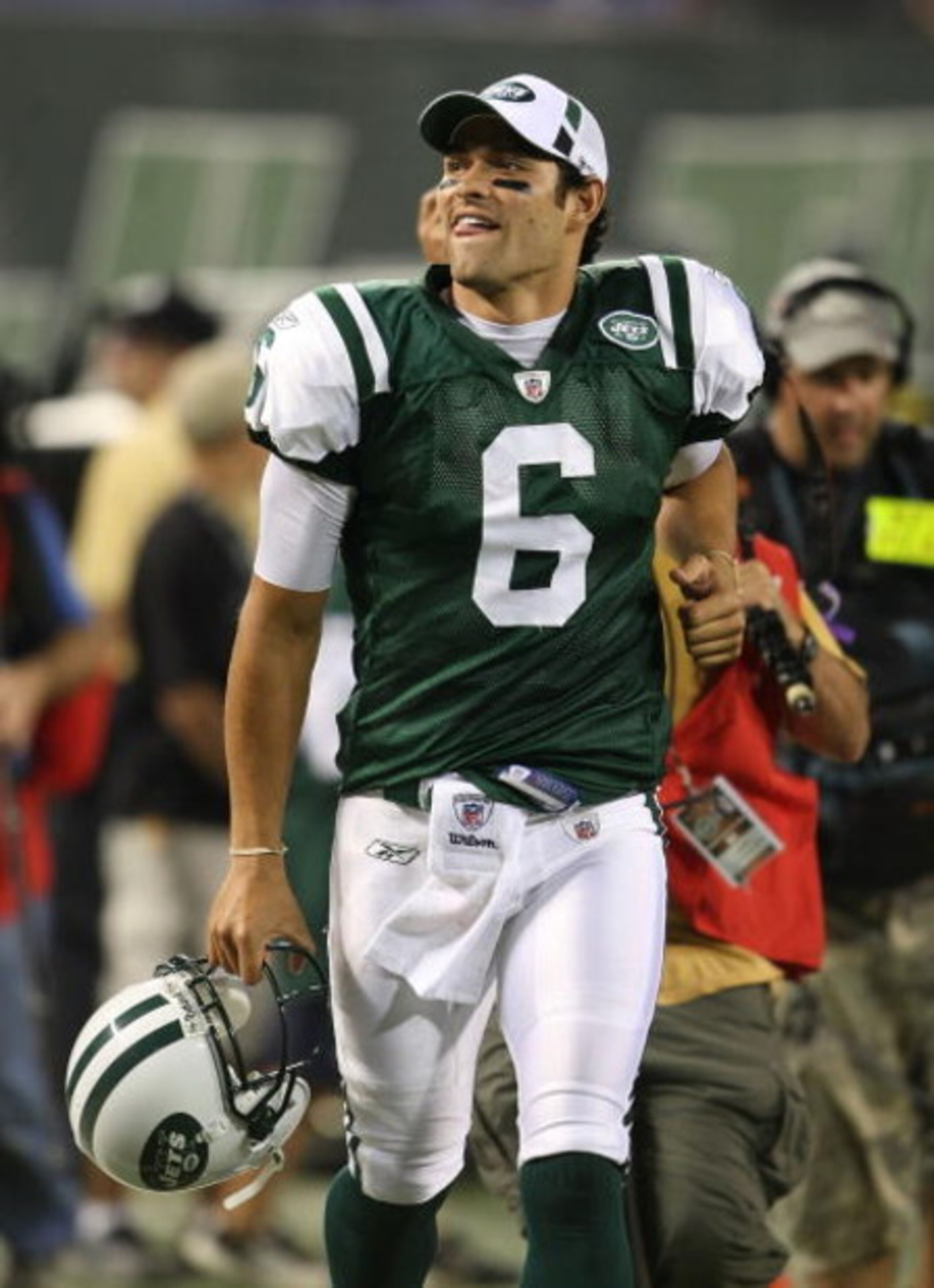 EAST RUTHERFORD, NJ - AUGUST 14:  Mark Sanchez #6 of the New York Jets leaves the field after his first game against the St. Louis Rams during their preseason game at Giants Stadium on August 14, 2009  in East Rutherford, New Jersey.  (Photo by Nick Laham