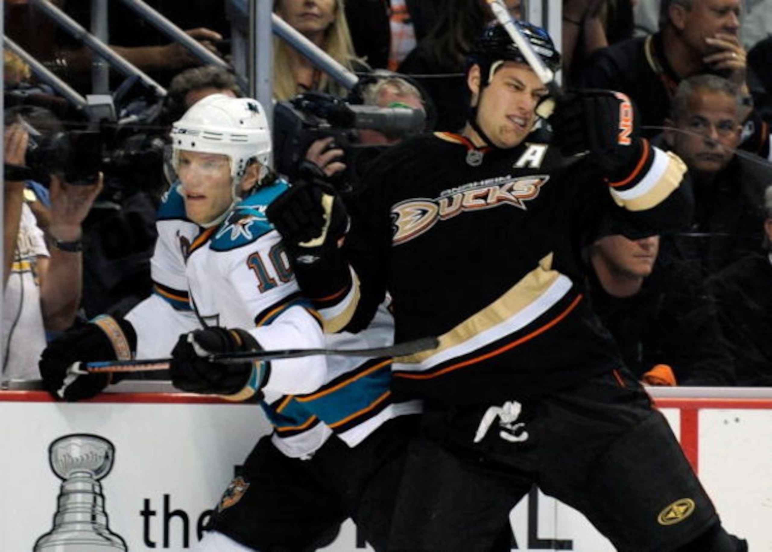 ANAHEIM, CA - APRIL 23:   Ryan Getzlaf #15 of the Anaheim Ducks checks Christian Ehrhoff #10 of the San Jose Sharks in the first period during Game Four of the Western Conference Quarterfinal Round of the 2009 Stanley Cup Playoffs at Honda Center on April