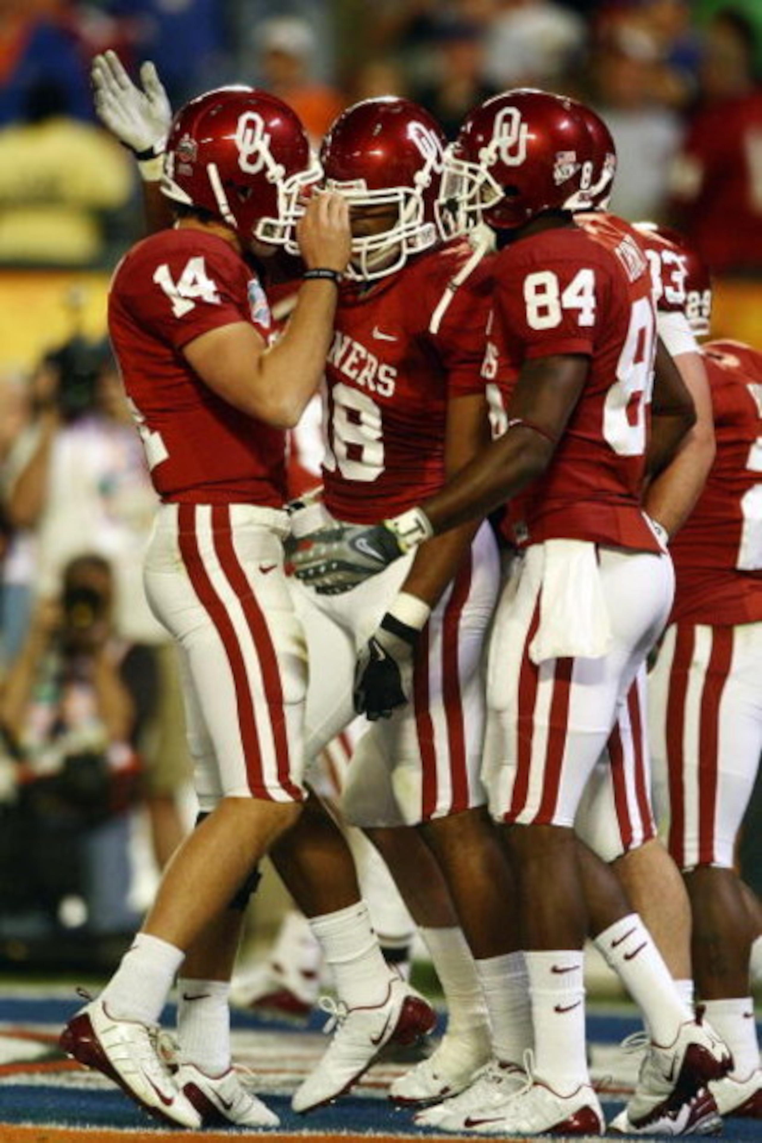 MIAMI - JANUARY 08:  Sam Bradford #14 of the Oklahoma Sooners celebrates with teammates Jermaine Gresham #18 and Quentin Chaney #84 after scoring a touchdown againist the Florida Gators during the FedEx BCS National Championship Game at Dolphin Stadium on