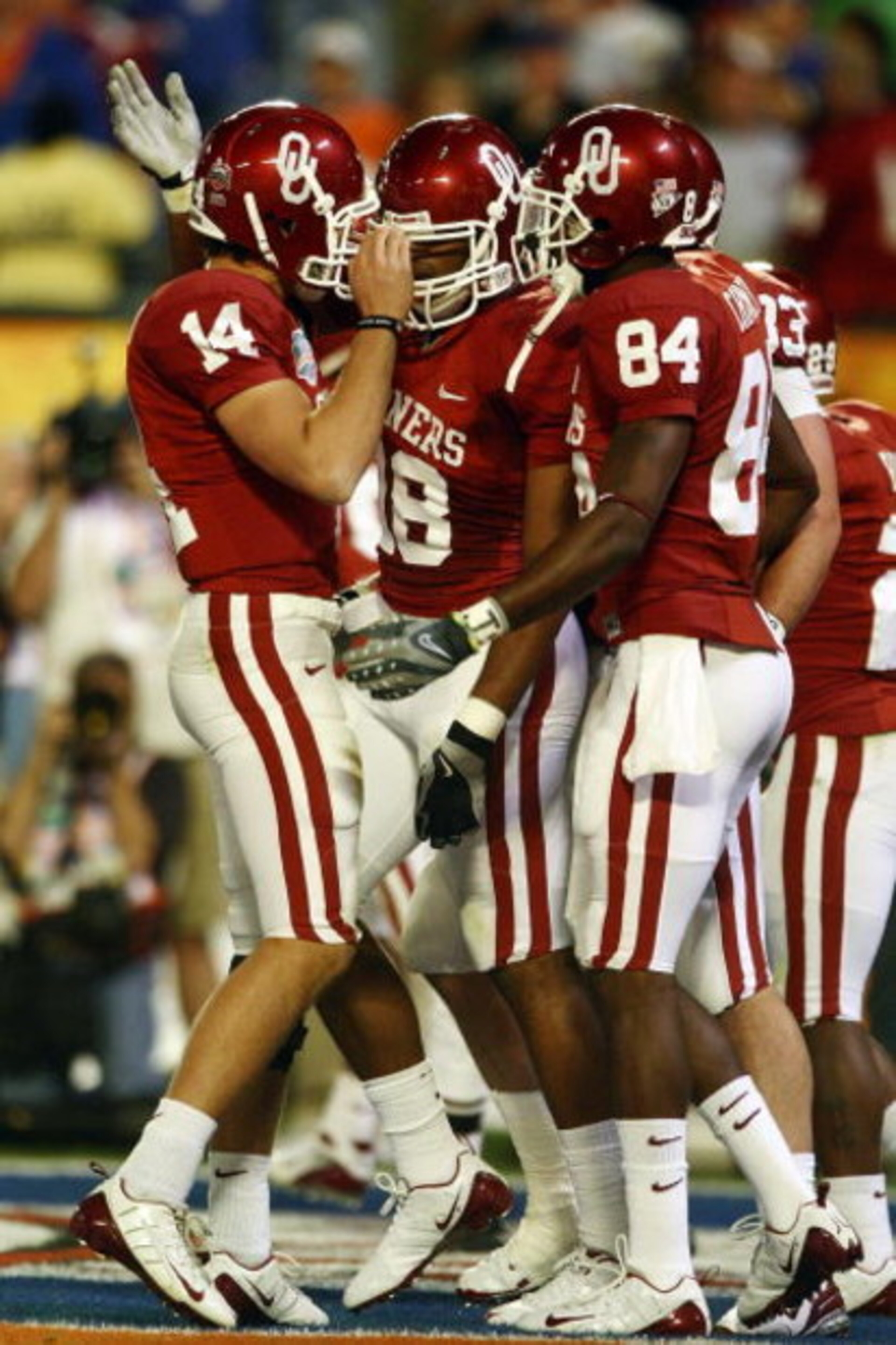 MIAMI - JANUARY 08:  Sam Bradford #14 of the Oklahoma Sooners celebrates with teammates Jermaine Gresham #18 and Quentin Chaney #84 after scoring a touchdown againist the Florida Gators during the FedEx BCS National Championship Game at Dolphin Stadium on