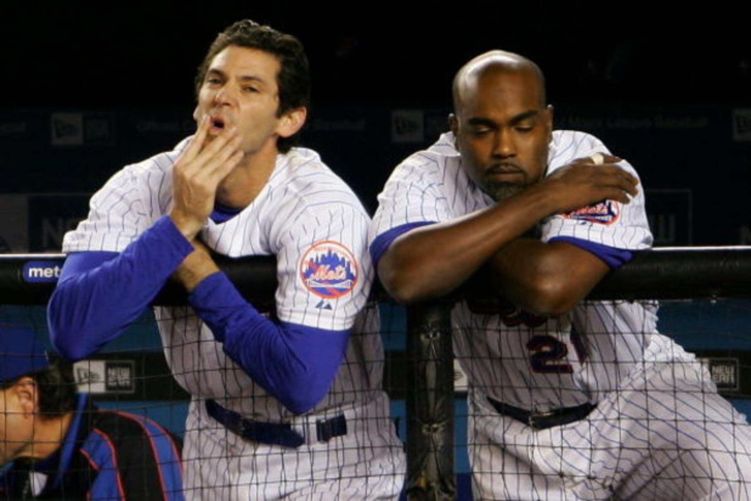 NEW YORK - SEPTEMBER 28: Shawn Green #20 and Carlos Delgado #21 of the New York Mets watch on from the dugout in the bottom of the nineth inning against the Florida Marlins during the MLB game at Shea Stadium on September 28, 2007 in the Flushing neighbor NEW YORK - SEPTEMBER 28: Shawn Green #20 and Carlos Delgado #21 of the New York Mets watch on from the dugout in the bottom of the nineth inning against the Florida Marlins during the MLB game at Shea Stadium on September 28, 2007 in the Flushing neighbor