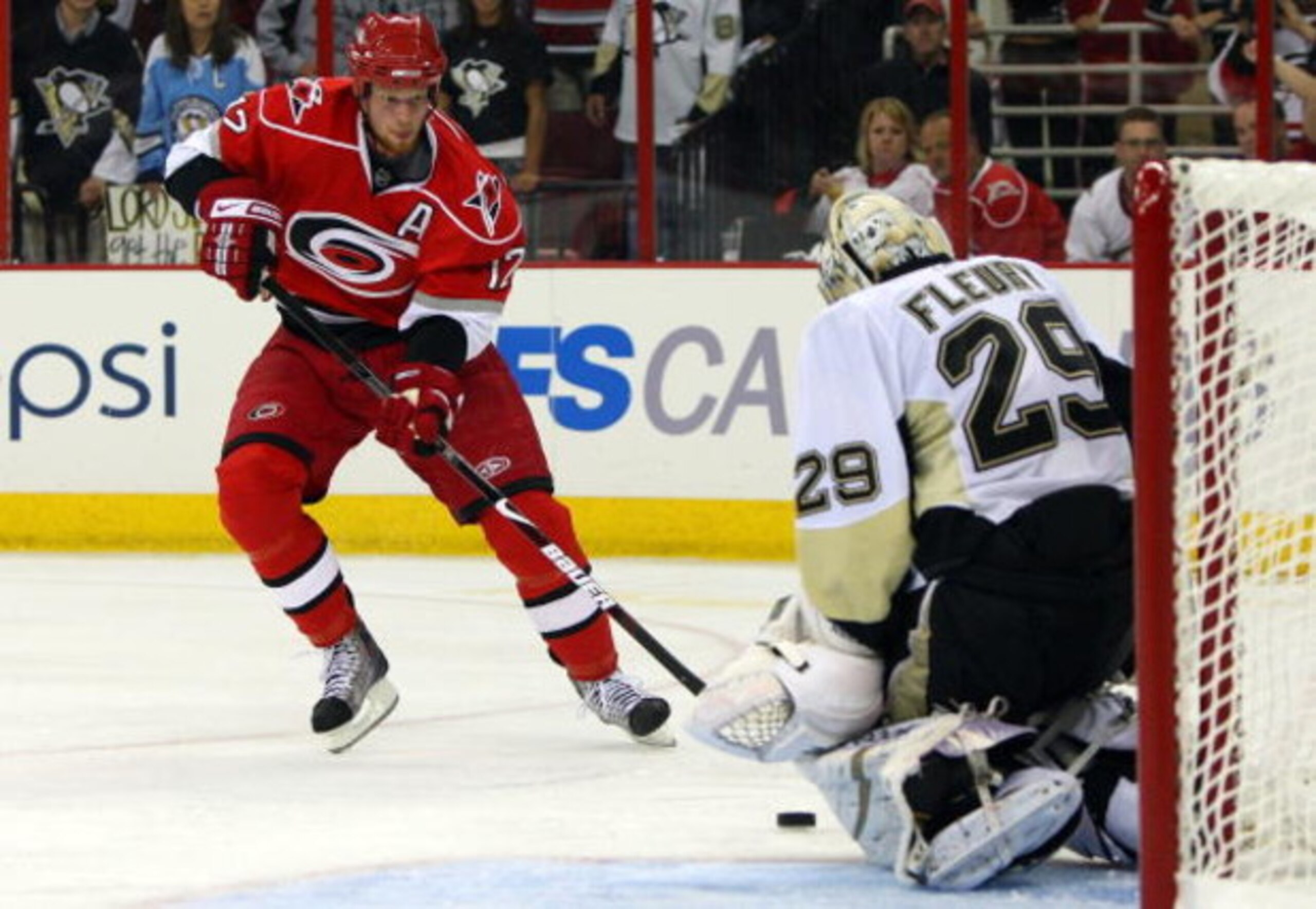 RALEIGH, NC - MAY 26:  Goaltender Marc-Andre Fleury #29 of the Pittsburgh Penguins saves a shot on goal by Eric Staal #12 of the Carolina Hurricanes during Game Four of the Eastern Conference Championship Round of the 2009 Stanley Cup Playoffs at RBC Cent