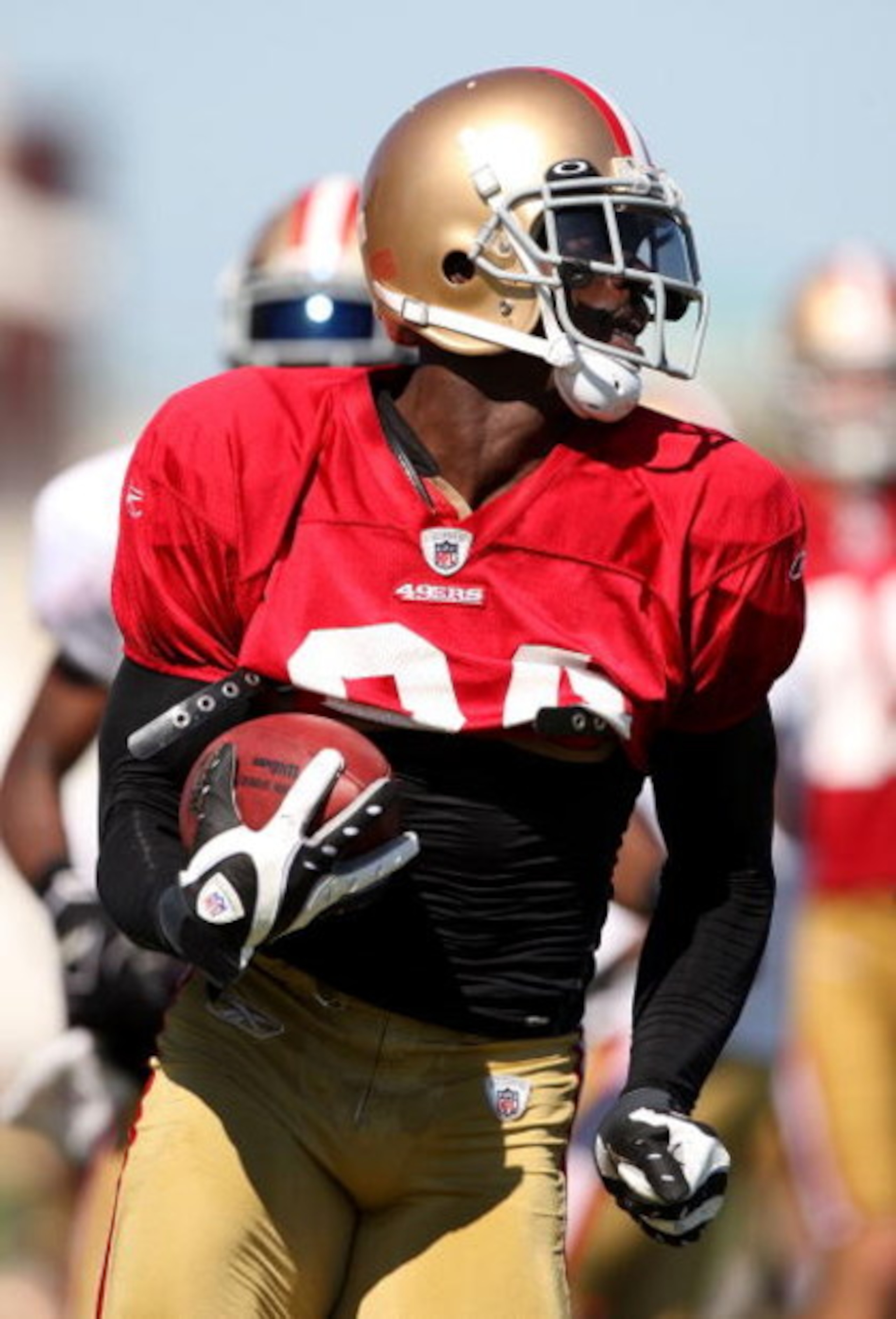SANTA CLARA, CA - AUGUST 04:  Josh Morgan #84 runs with the ball during the 49ers training camp at their practice facilities on August 4, 2009 in Santa Clara, California.  (Photo by Jed Jacobsohn/Getty Images)
