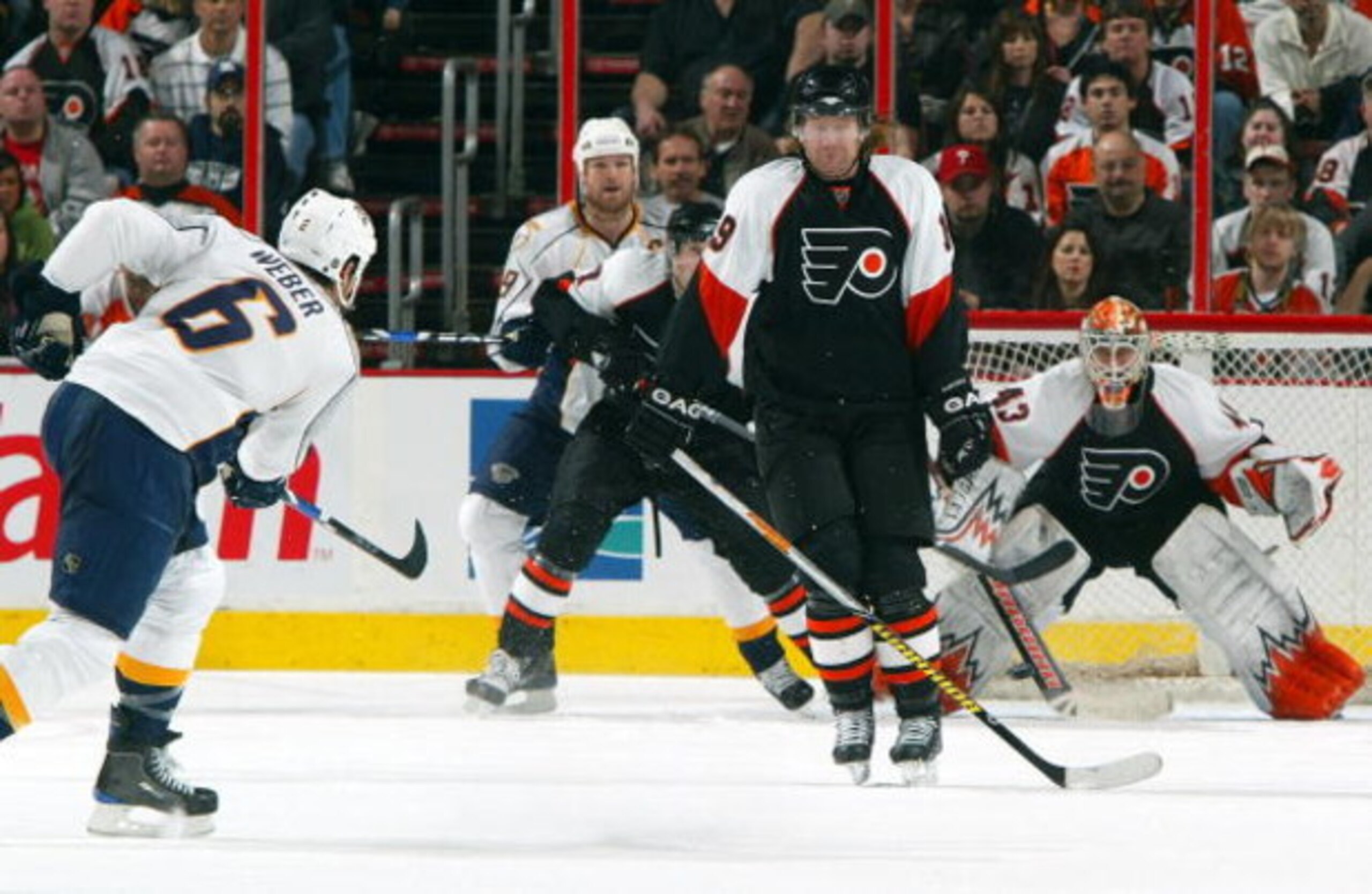 PHILADELPHIA - MARCH 07:  Scott Hartnell #19 of the Philadelphia Flyers tries to block a shot from Shea Weber #6 of the Nashville Predators on March 7, 2009 at Wachovia Center in Philadelphia, Pennsylvania.  (Photo by Jim McIsaac/Getty Images)