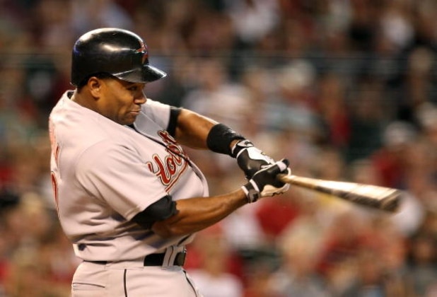 PHOENIX - JUNE 14:  Miguel Tejada #10 of the Houston Astros hits a RBI ground out against the Arizona Diamondbacks during the seventh inning of the major league baseball game at Chase Field on June 14, 2009 in Phoenix, Arizona.  (Photo by Christian Peters