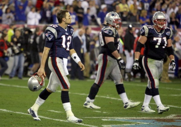 GLENDALE, AZ - FEBRUARY 03:  Tom Brady #12 of the New England Patriots walks off the field during Super Bowl XLII against the New York Giants on February 3, 2008 at the University of Phoenix Stadium in Glendale, Arizona.  (Photo by Donald Miralle/Getty Im
