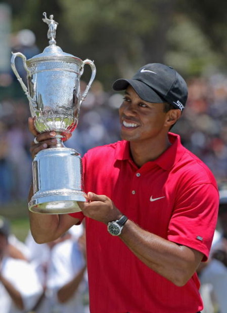 SAN DIEGO - JUNE 16:  Tiger Woods celebrates with the trophy after winning on the first sudden death playoff hole during the playoff round of the 108th U.S. Open at the Torrey Pines Golf Course (South Course) on June 16, 2008 in San Diego, California.  (P