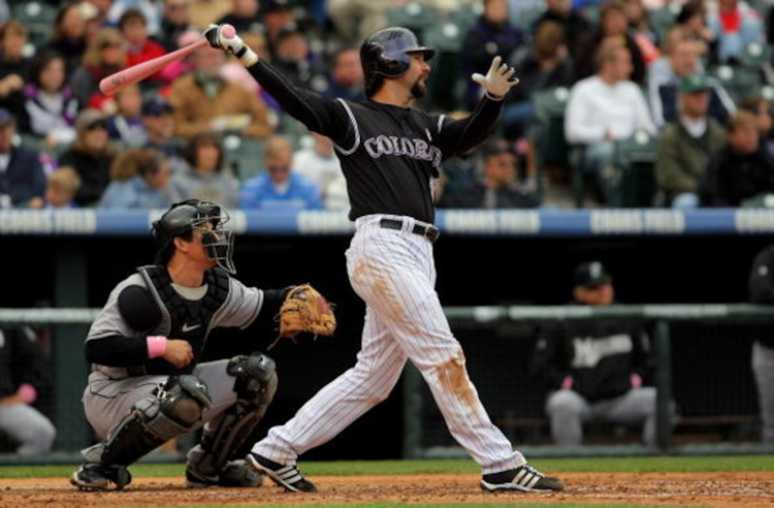 DENVER - MAY 10:  Todd Helton #17 of the Colorado Rockies takes an at bat against the Florida Marlins during MLB action at Coors Field on May 10, 2009 in Denver, Colorado. Helton went two for four as he was one of many players using pink bats in Major Lea