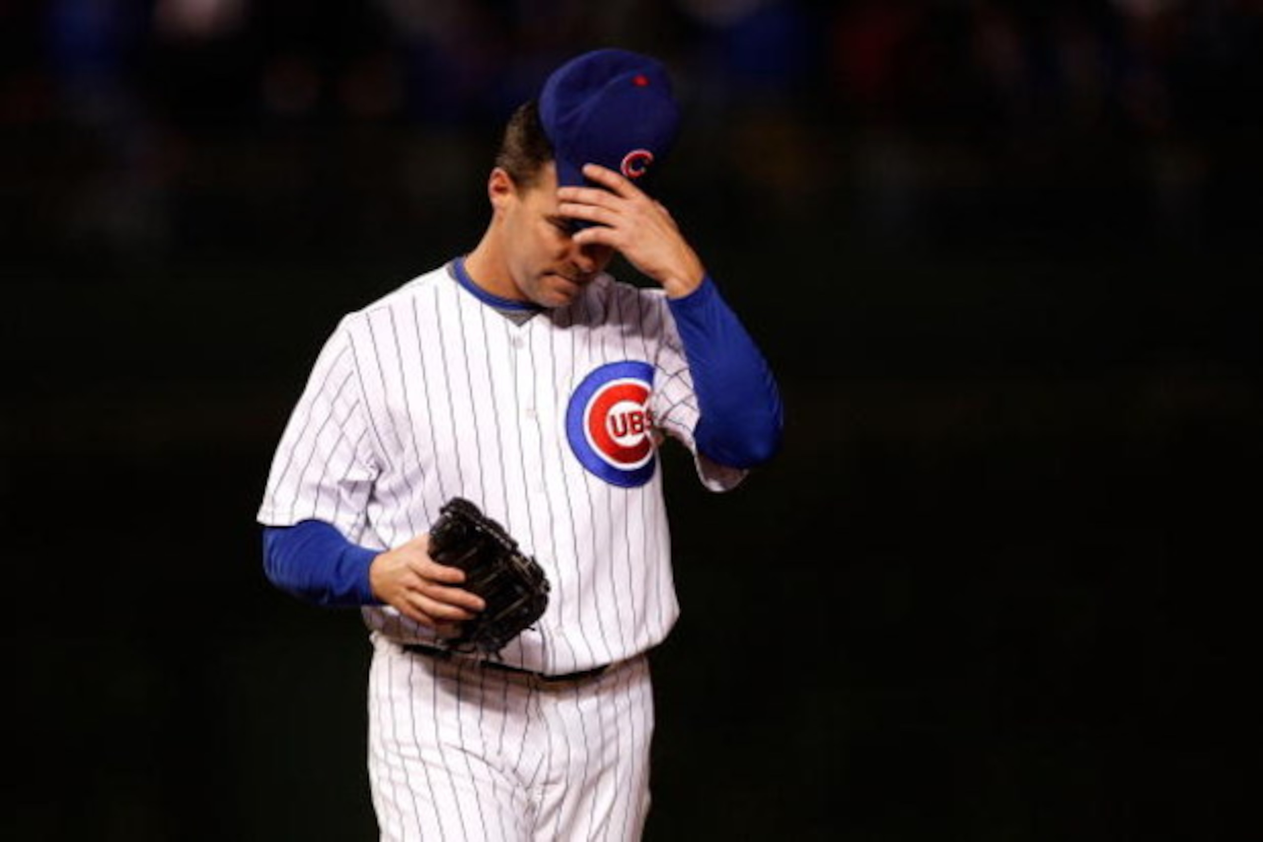CHICAGO - OCTOBER 01:  Jim Edmonds #15 of the Chicago Cubs adjusts his hat against the Los Angeles Dodgers in Game One of the NLDS during the 2008 MLB Playoffs at Wrigley Field on October 1, 2008 in Chicago, Illinois. The Dodgers won 7-2. (Photo by Jamie 