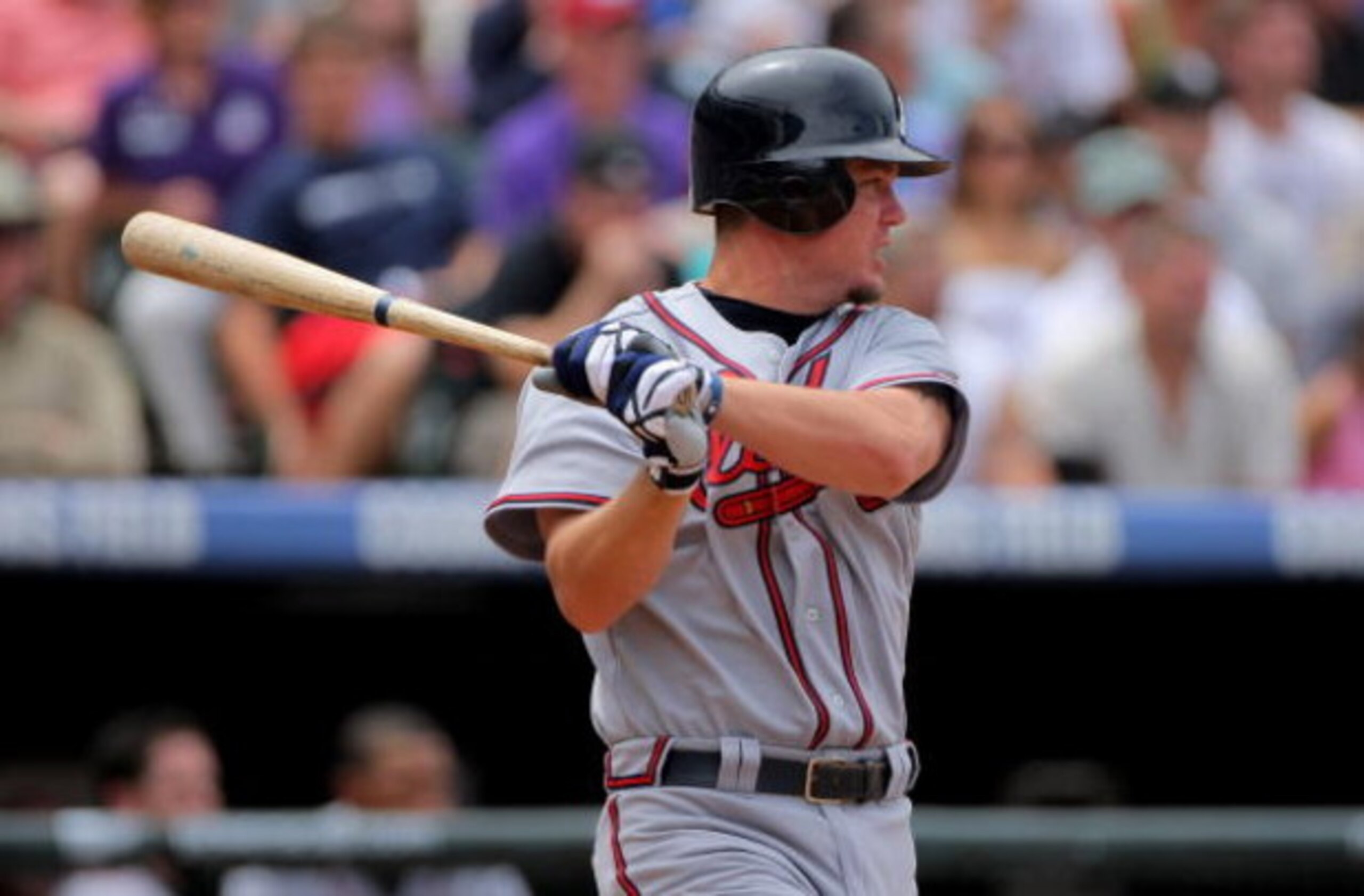 DENVER - JULY 12:  Chipper Jones #10 of the Atlanta Braves takes an at bat against the Colorado Rockies during MLB action at Coors Field on July 12, 2009 in Denver, Colorado. The Rockies defeated the Braves 8-7.  (Photo by Doug Pensinger/Getty Images)