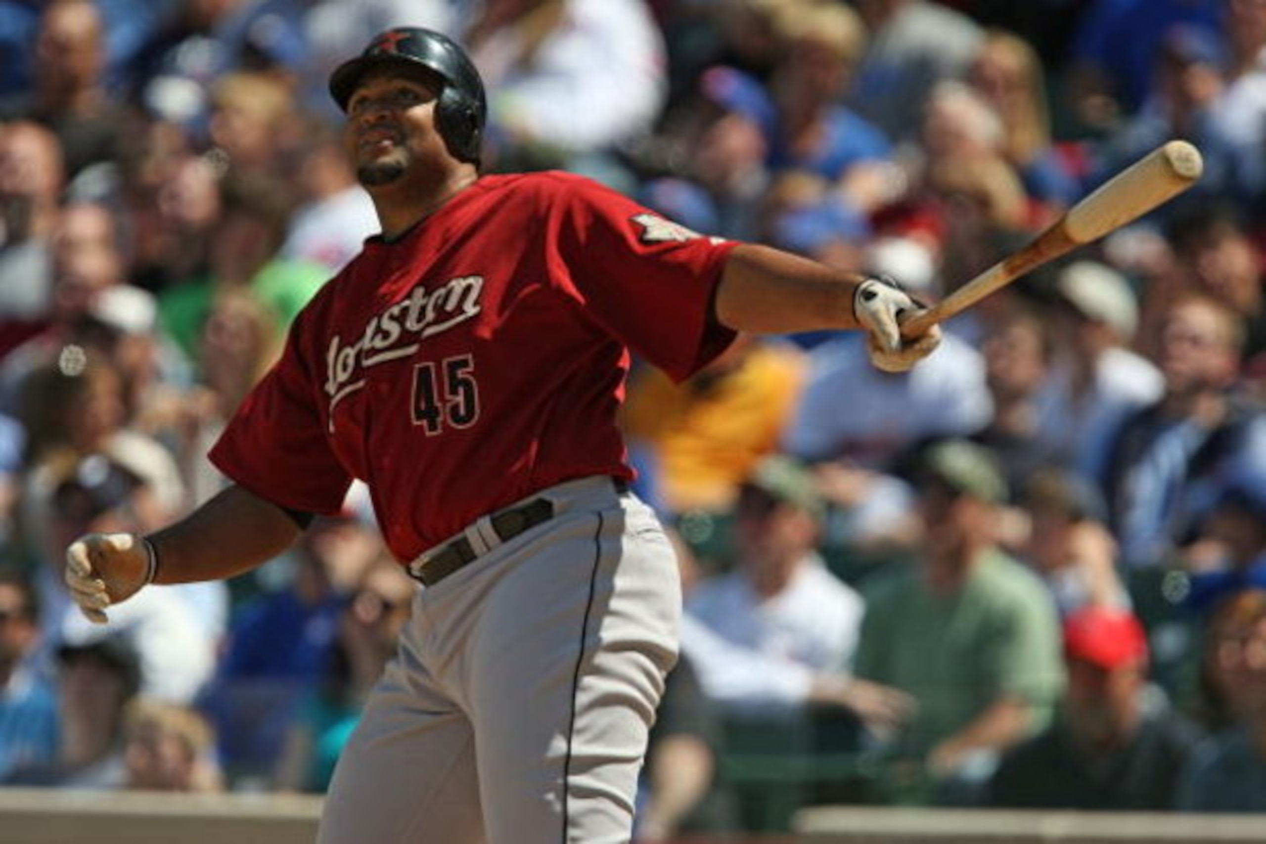 CHICAGO - MAY 16: Carlos Lee #45 of the Houston Astros follows the flight of his home run hit in the 9th inning against the Chicago Cubs on May 16, 2009 at Wrigley Field in Chicago, Illinois. The Cubs defeated the Astros 5-4. (Photo by Jonathan Daniel/Get