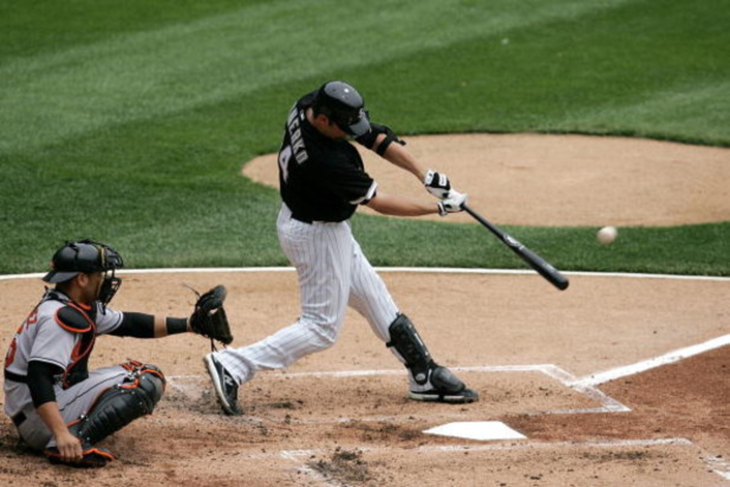 CHICAGO - APRIL 27:  Paul Konerko #14 of the Chicago White Sox hits a solo home run in the bottom of the second inning to give the White Sox a 1-0 lead against the Baltimore Orioles on April 27, 2008 at U.S. Cellular Field in Chicago, Illinois.  (Photo by