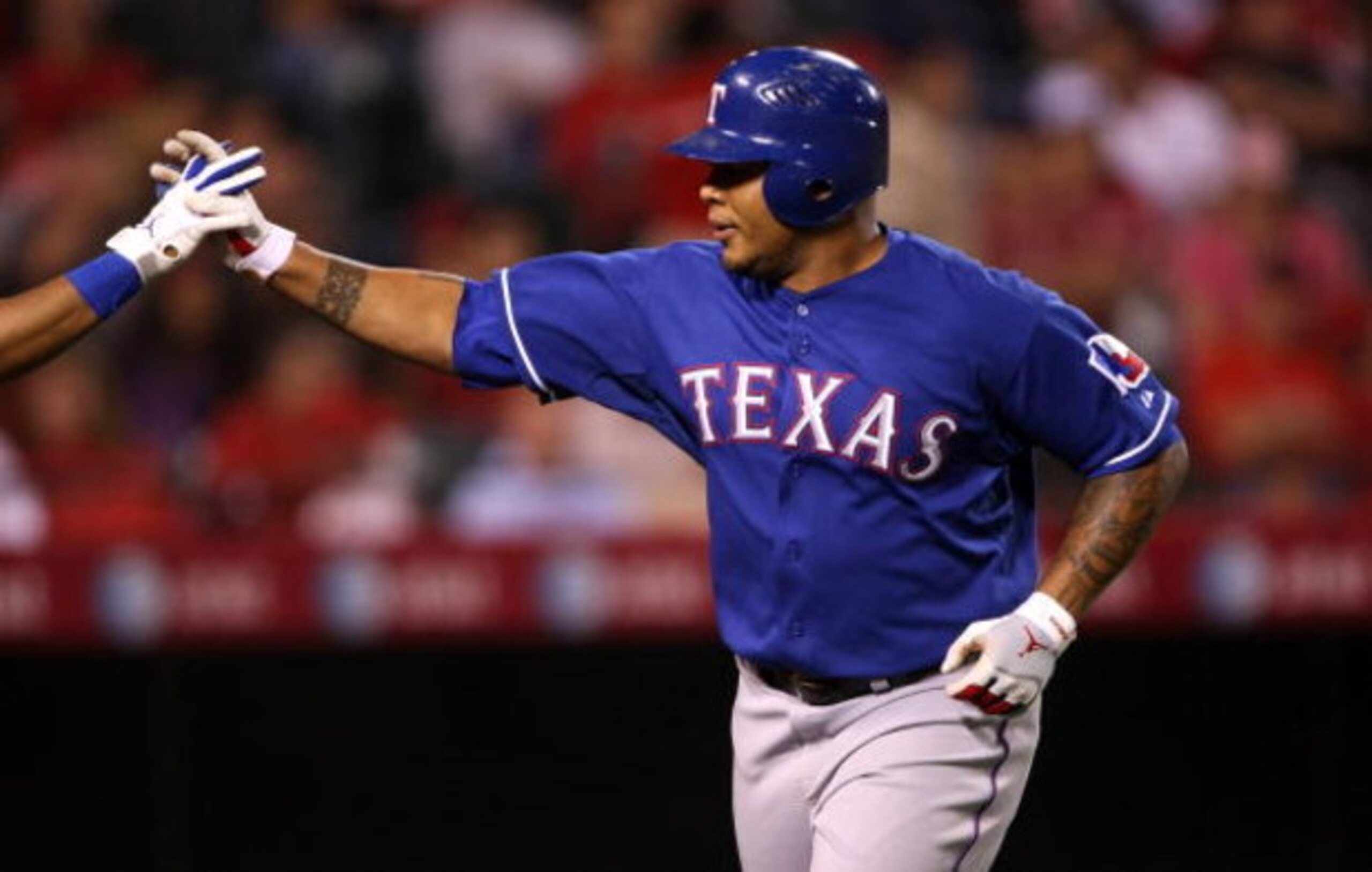 ANAHEIM, CA - JULY 08:  Andruw Jones #25 of the Texas Rangers celebrates after hitting his third home run of the game against the Los Angeles Angels of Anaheim in the fifth inning at Angel Stadium July 8, 2009 in Anaheim, California.  (Photo by Stephen Du