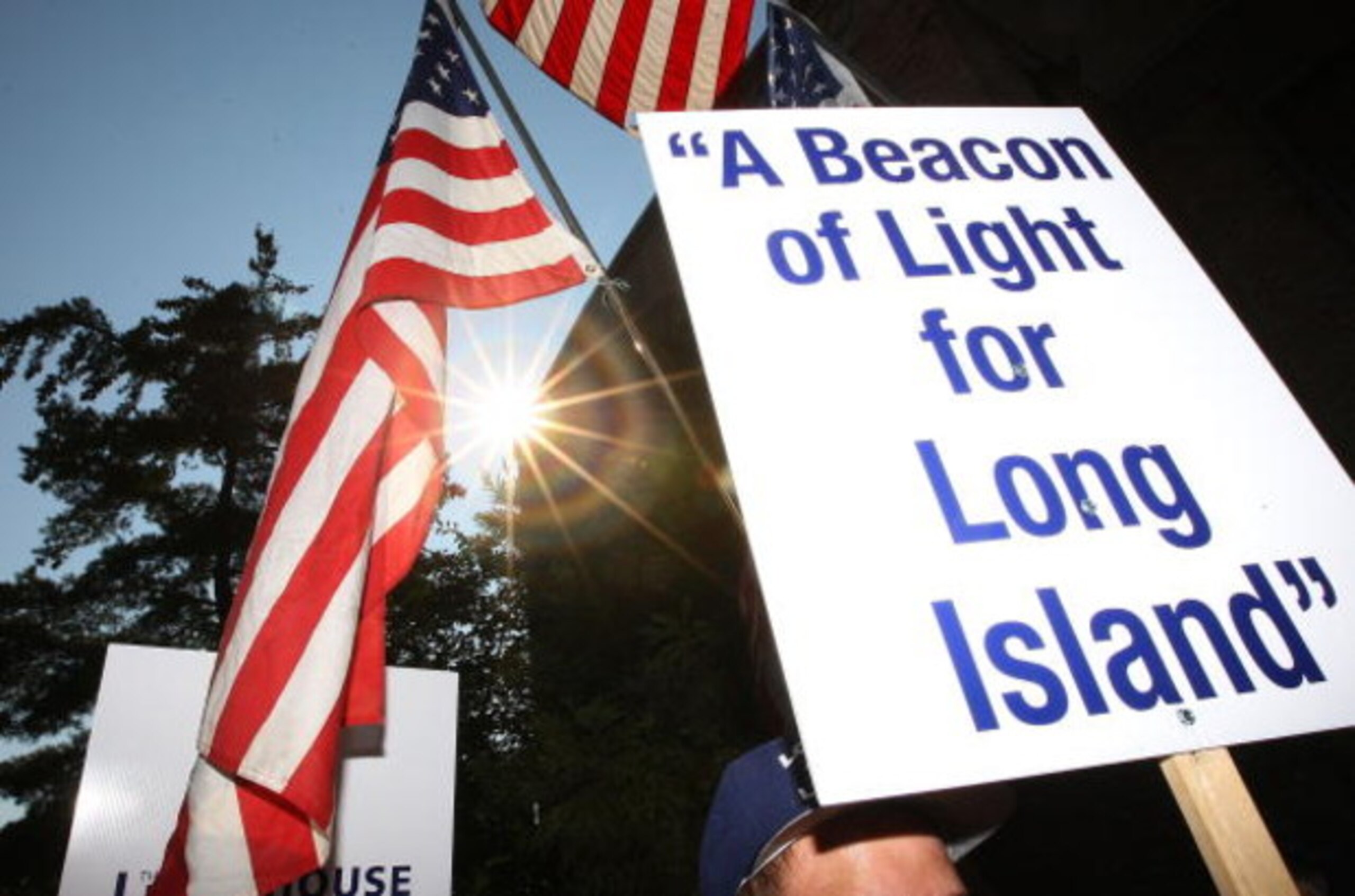 UNIONDALE, NY - AUGUST 04:  Fans rally for support at Lot 8 of the Nassau Coliseum prior to marching to the Lighthouse project public hearing at the Adams Playhouse on the campus of Hofstra University on August 4, 2009  in Uniondale, New York.  (Photo by 