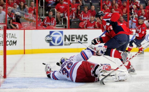 WASHINGTON - APRIL 28:  Viktor Kozlov #25 of the Washington Capitals takes a shot on goal against Henrik Lundqvist #30 of the New York Rangers during Game Seven of the Eastern Conference Quarterfinal Round of the 2009 Stanley Cup Playoffs on April 28, 200
