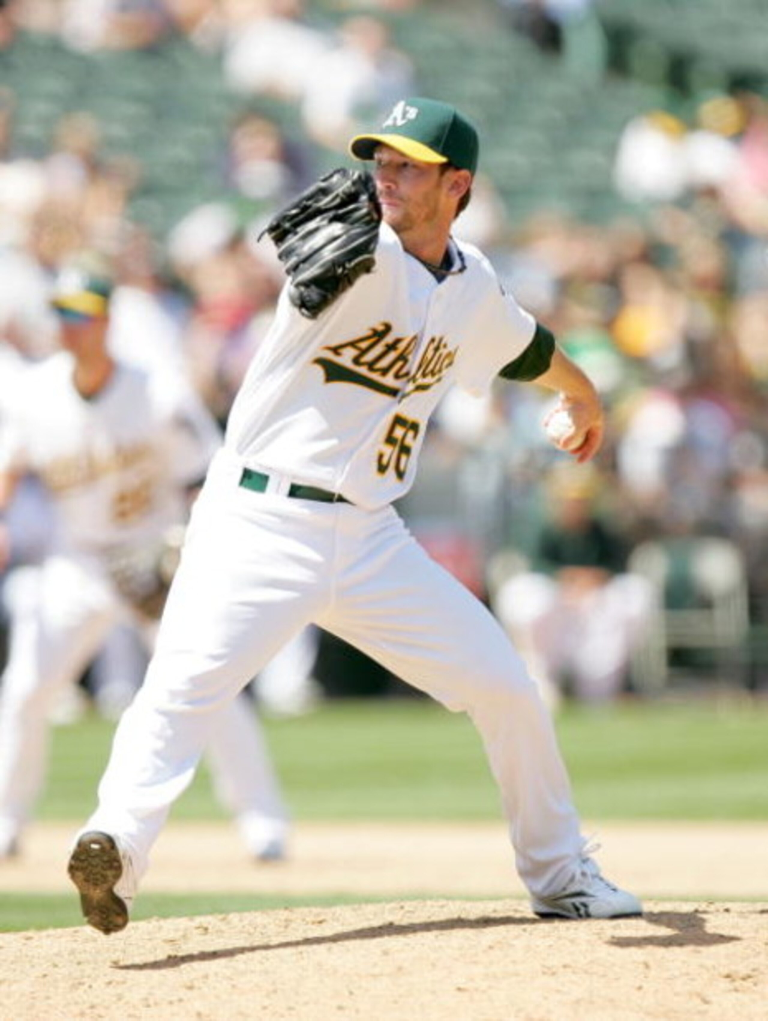 OAKLAND, CA - MAY 27:  Craig Breslow #56 of the Oakland Athletics pitches to the Seattle Mariners at the Oakland Coliseum on May 27, 2009 in Oakland, California.  (Photo by Ezra Shaw/Getty Images)