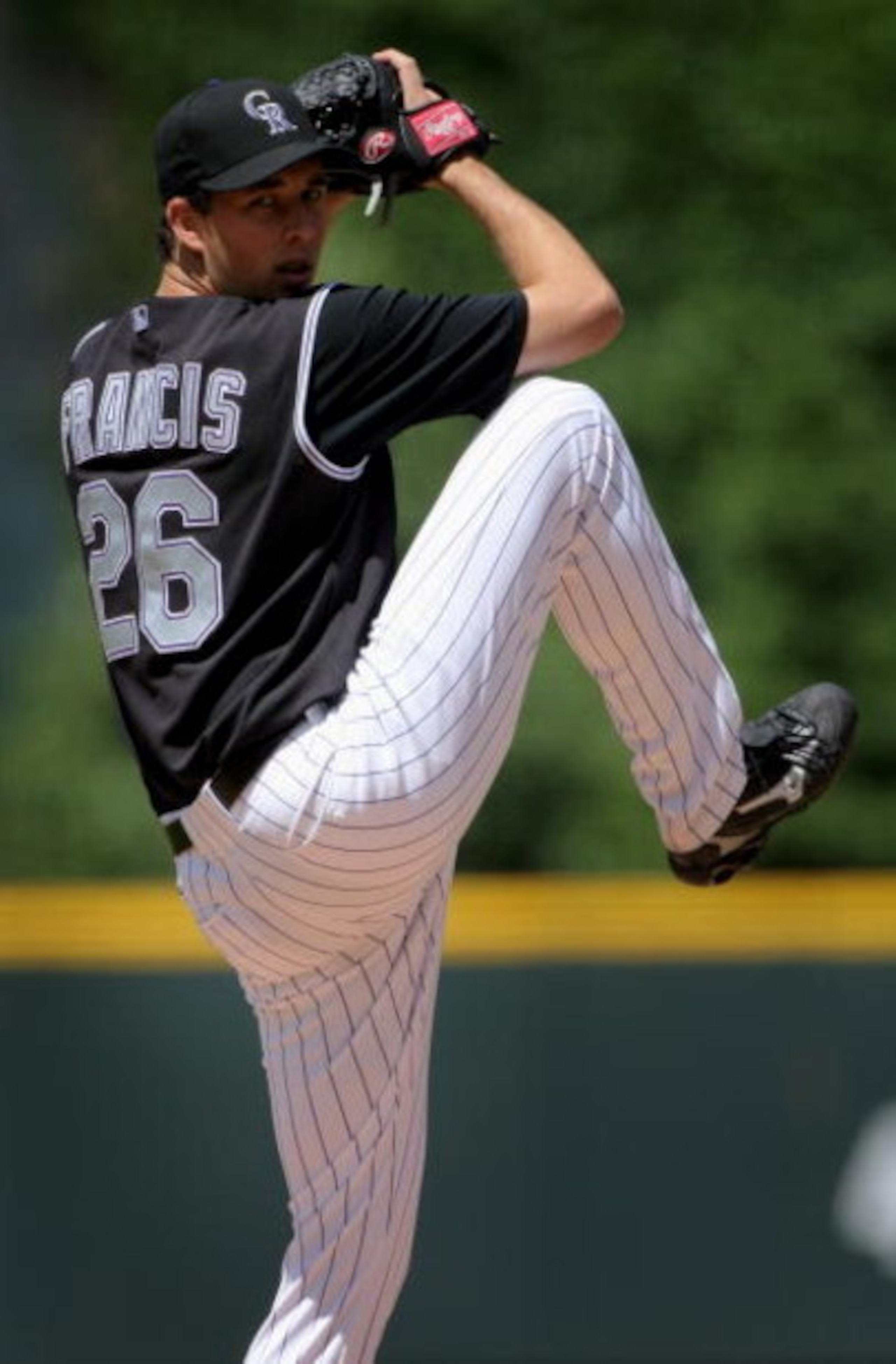DENVER - MAY 24:  Starting pitcher Jeff Francis #26 of the Colorado Rockies delivers against the New York Mets in the first inning at Coors Field on May 24, 2008 in Denver, Colorado. Francis collected the loss as the Mets defeated the Rockies 9-2.  (Photo