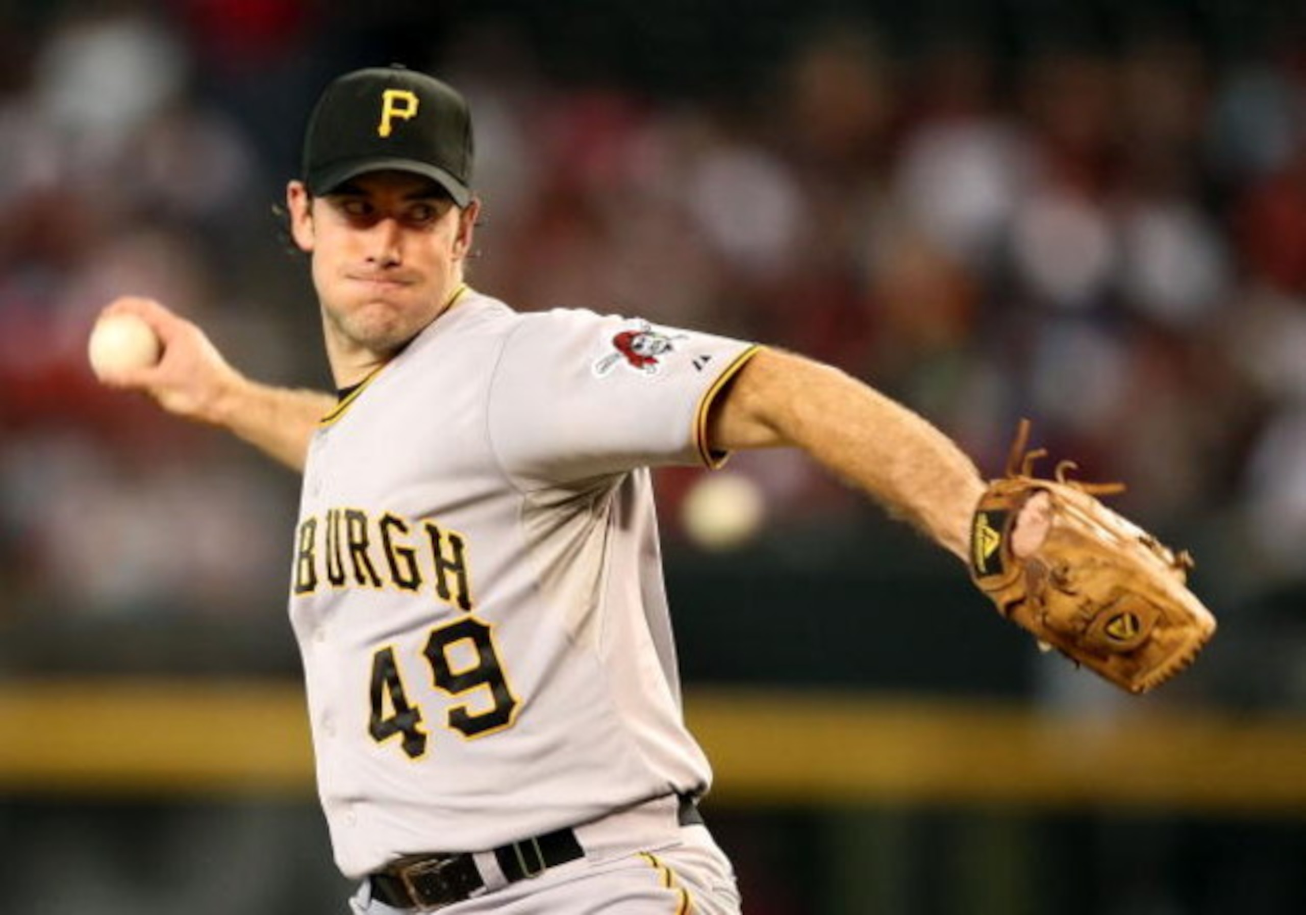 PHOENIX - JULY 25:  Starting pitcher Ross Ohlendorf #49 of the Pittsburgh Pirates pitches against the Arizona Diamondbacks during the major league baseball game at Chase Field on July 25, 2009 in Phoenix, Arizona.  (Photo by Christian Petersen/Getty Image