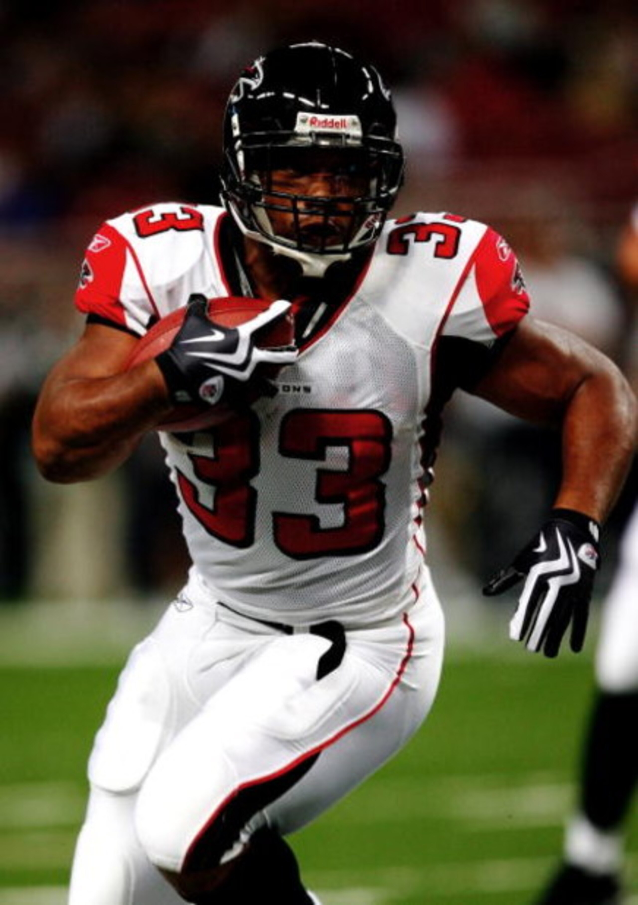 ST. LOUIS, MO - AUGUST 21: Running back Michael Turner #33 of the Atlanta Falcons runs the ball against the St. Louis Rams during the preseason game at the Edward Jones Dome on August 21, 2009 in St. Louis, Missouri. (Photo by Dilip Vishwanat/Getty Images
