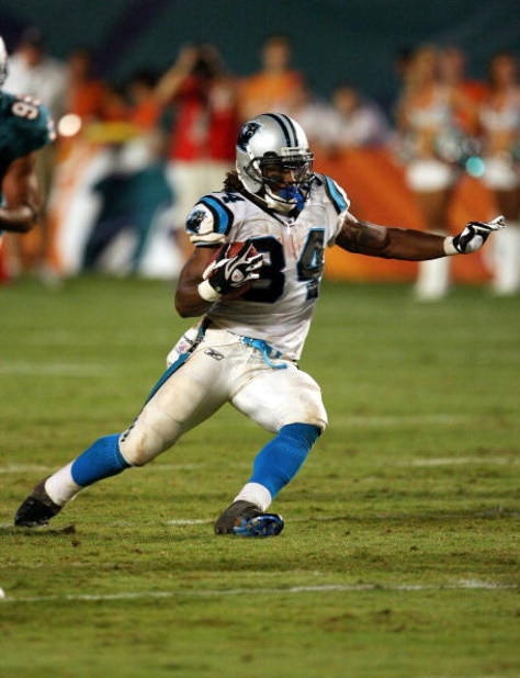 MIAMI - AUGUST 22:  Running back DeAngelo Williams #34 of the Carolina Panthers looks for room to run against the Miami Dolphins during a pre-season game at Land Shark Stadium on August 22, 2009 in Miami, Florida. The Dolphins defeated the Panthers 27-17.