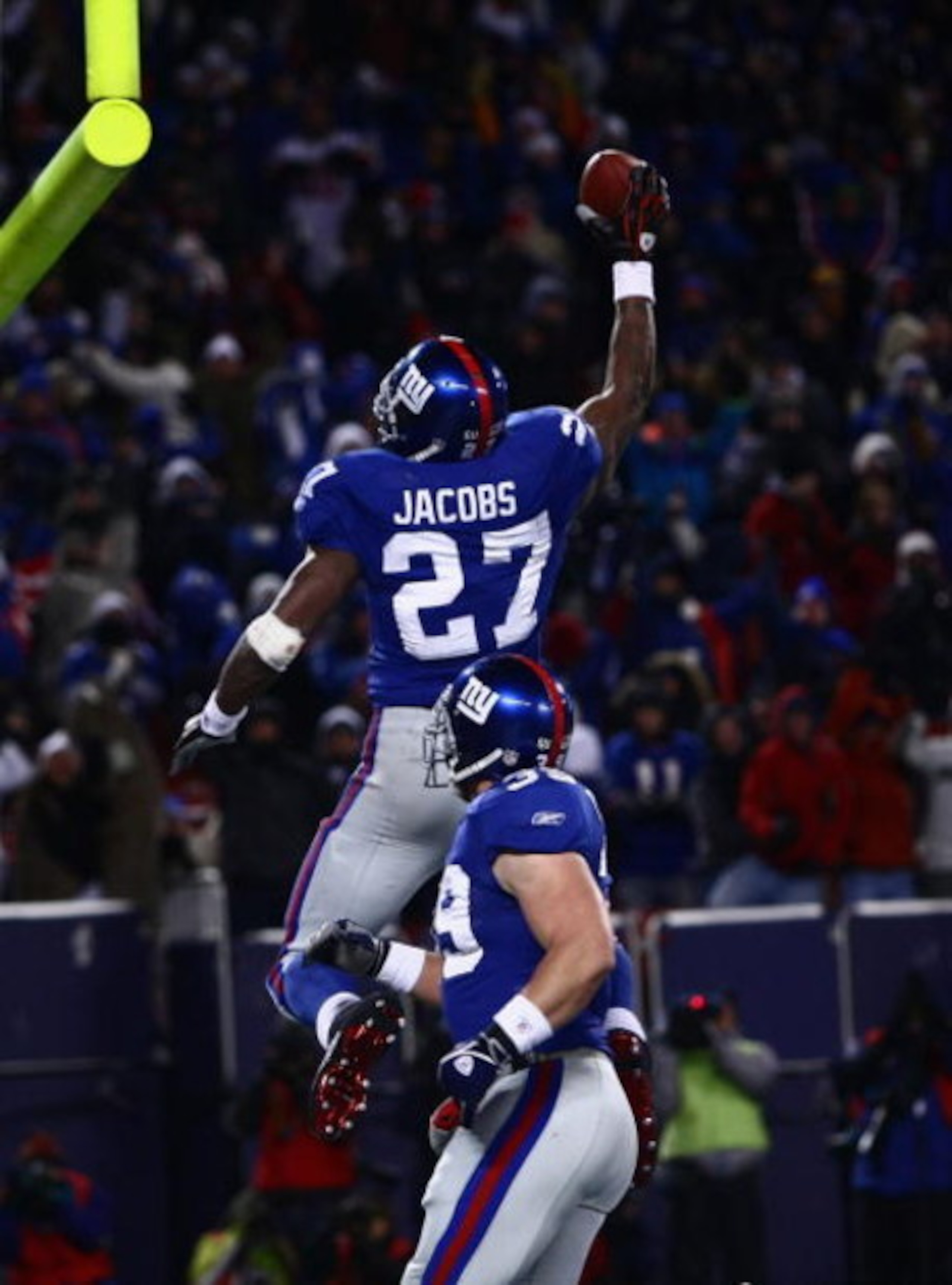EAST RUTHERFORD, NJ - DECEMBER 21:  Running back Brandon Jacobs #27 of the New York Giants celebrates in the end zone after scoring a touchdown against the Carolina Panthers on December 21, 2008 at Giants Stadium in East Rutherford, New Jersey.  (Photo by