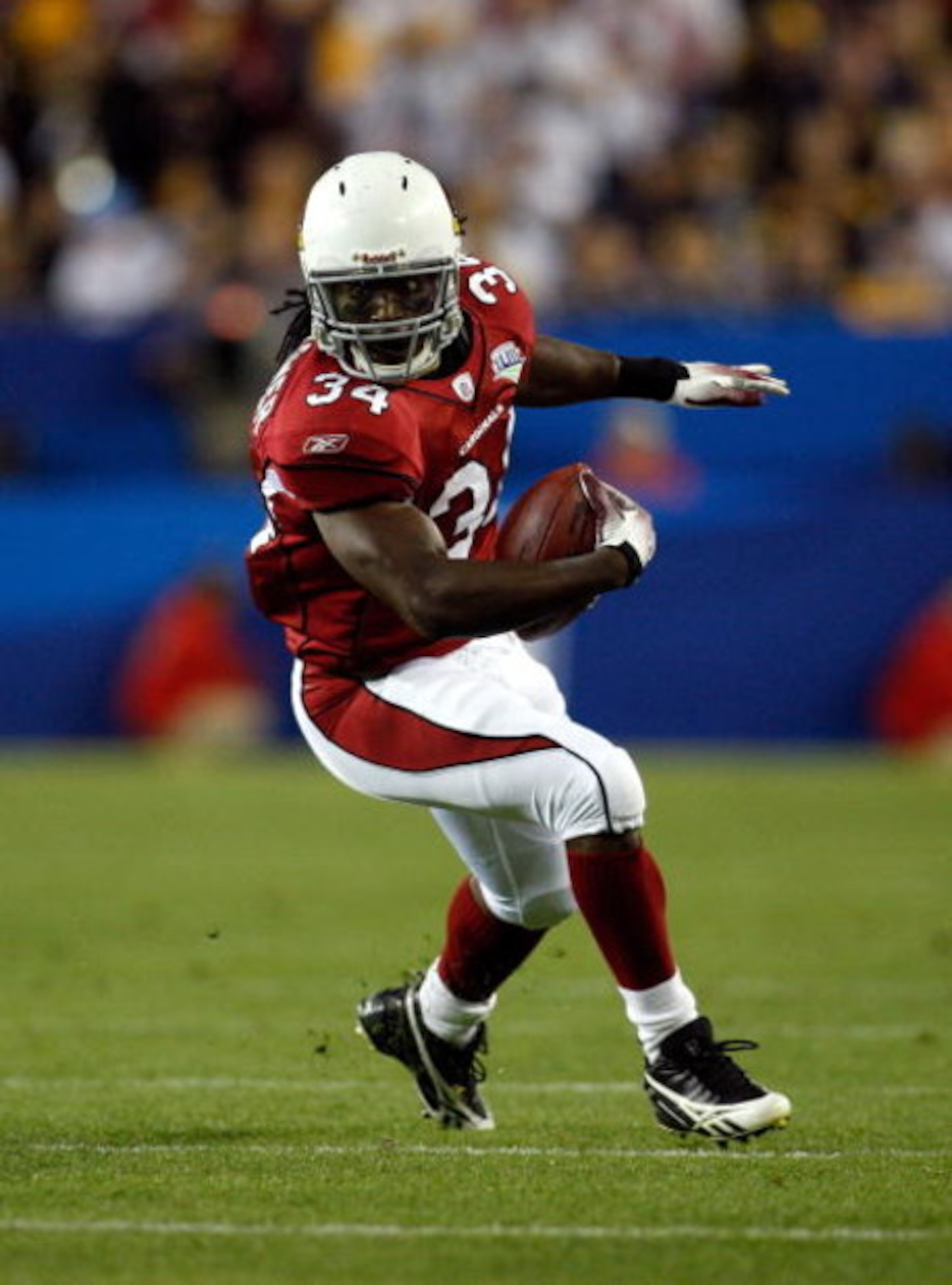 TAMPA, FL - FEBRUARY 01:  Running back Tim Hightower #34 of the Arizona Cardinals runs with the ball against the Pittsburgh Steelers during Super Bowl XLIII on February 1, 2009 at Raymond James Stadium in Tampa, Florida. Steelers won 27-23. (Photo by Chri