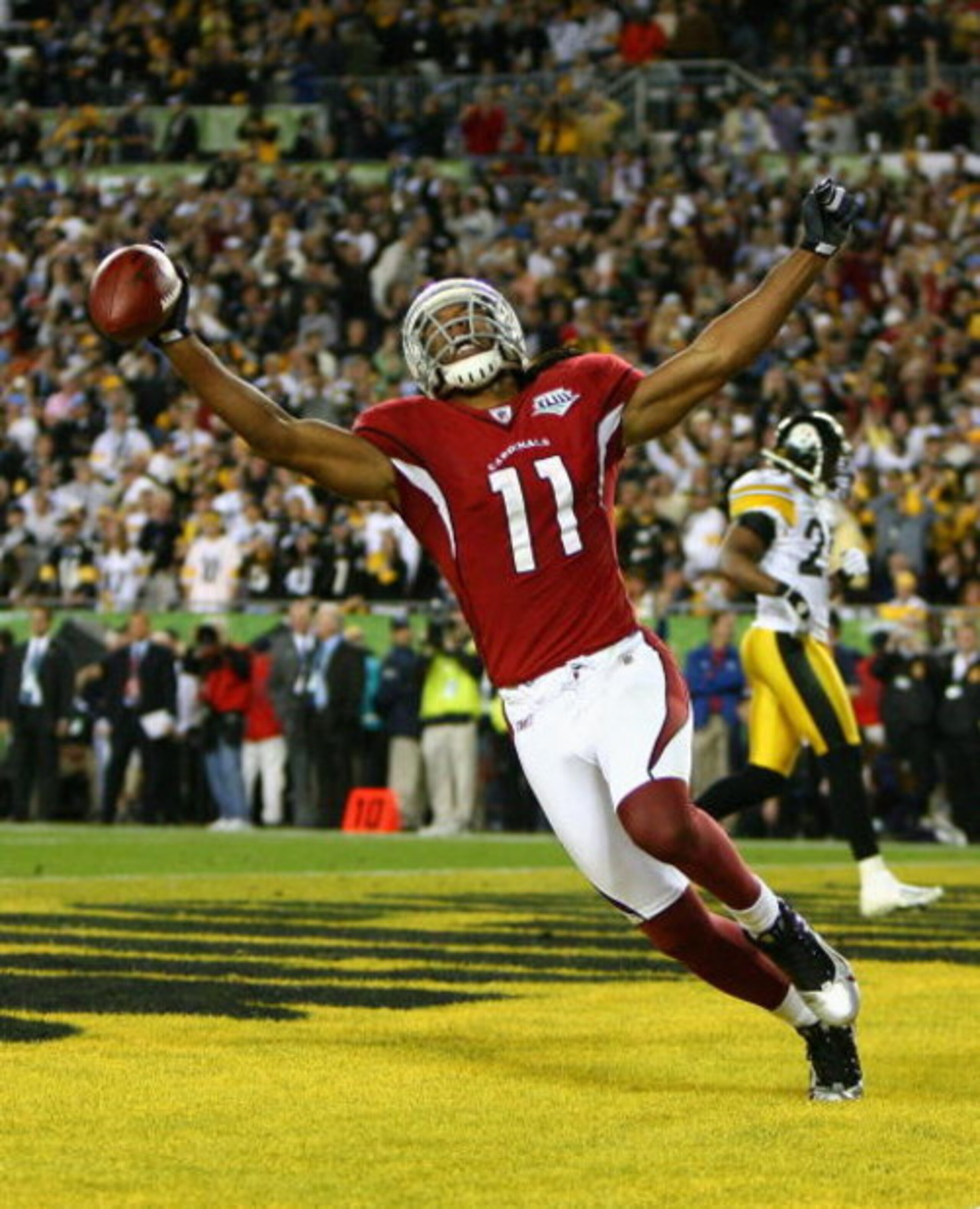 TAMPA, FL - FEBRUARY 01:  Larry Fitzgerald #11 of the Arizona Cardinals celebrates after scoring a touchdown in the fourth quarter against the Pittsburgh Steelers during Super Bowl XLIII on February 1, 2009 at Raymond James Stadium in Tampa, Florida.  (Ph