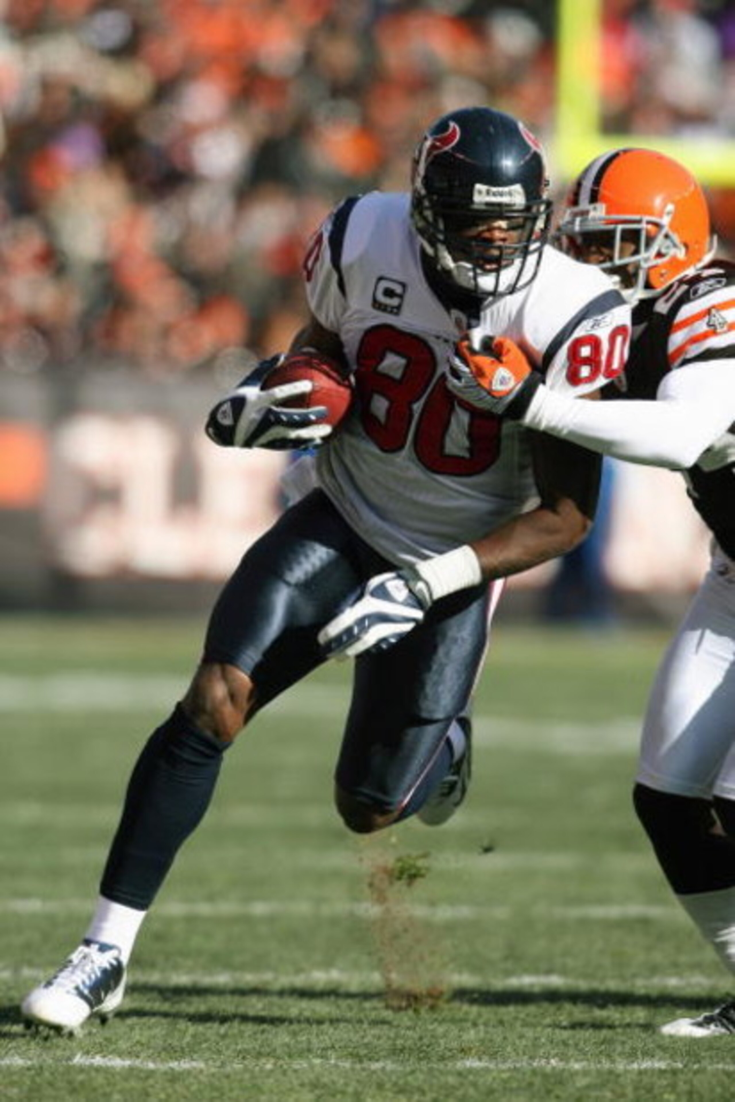 CLEVELAND - NOVEMBER 23:  Andre Johnson #80 of the Houston Texans carries the ball during the NFL game against the Cleveland Browns at Cleveland Browns Stadium on November 23, 2008 in Cleveland, Ohio.  (Photo by Andy Lyons/Getty Images)
