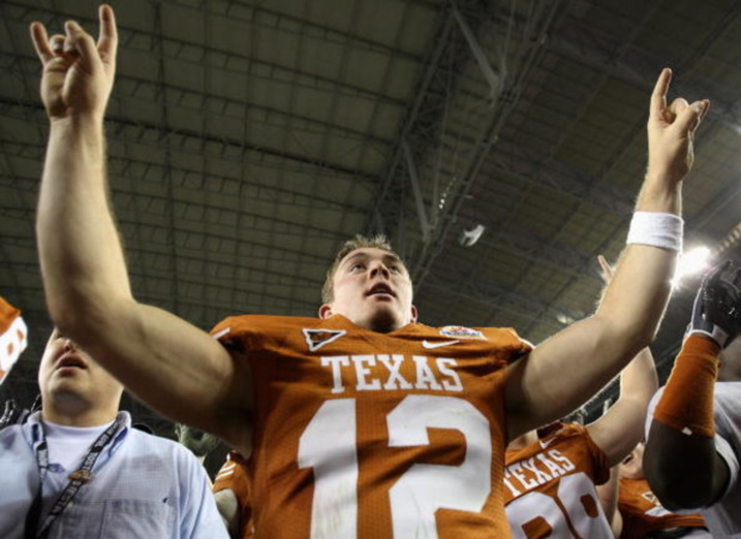 GLENDALE, AZ - JANUARY 05:  Quarterback Colt McCoy #12 of the Texas Longhorns celebrates after defeating the Ohio State Buckeyes in the Tostitos Fiesta Bowl Game on January 5, 2009 at University of Phoenix Stadium in Glendale, Arizona. The Longhorns defea
