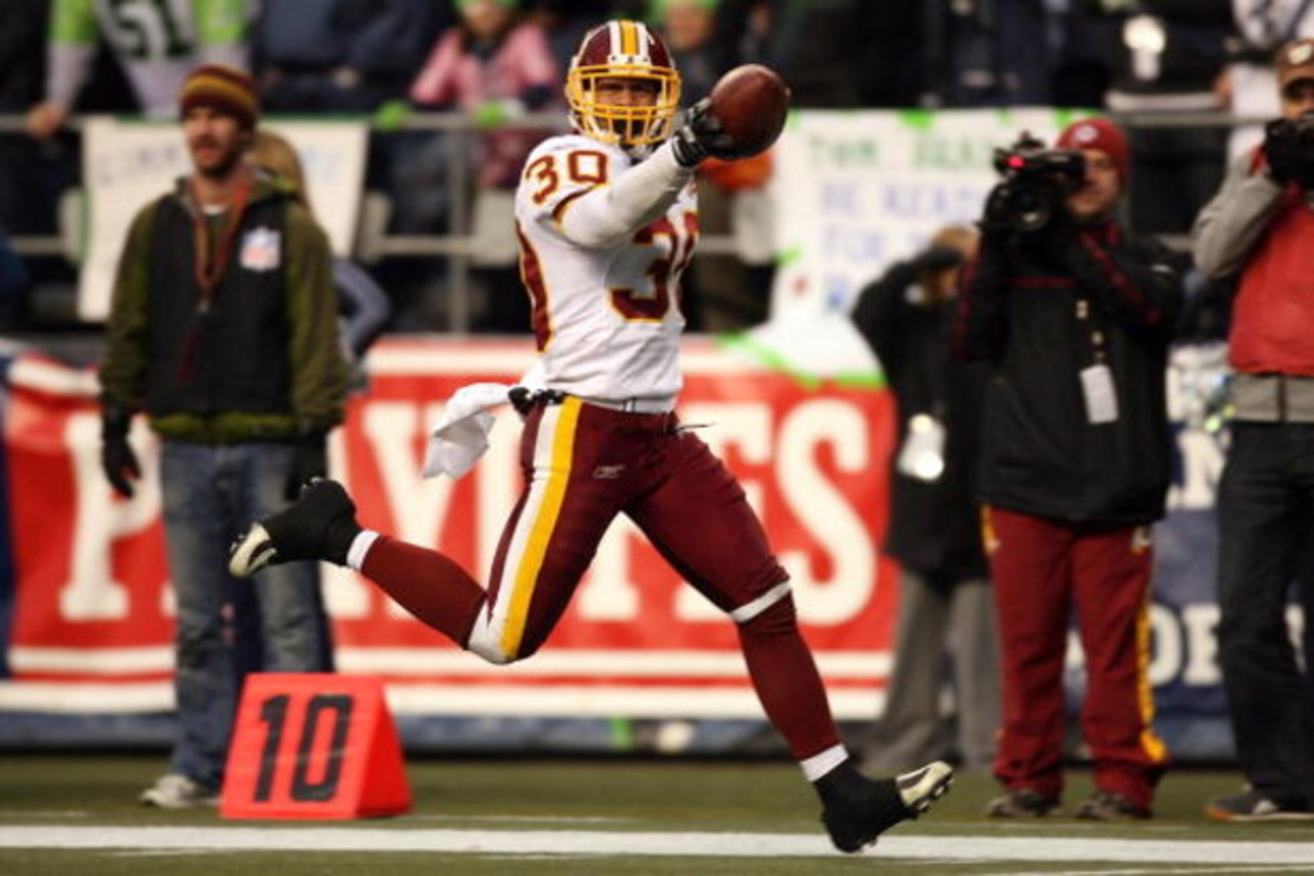 SEATTLE - JANUARY 05:  Safety LaRon Landry #30 of the Washington Redskins celebrates after intercepting a pass in the fourth quarter against the Seattle Seahawks during the NFC Wild Card game at Qwest Field on January 5, 2008 in Seattle, Washington.  (Pho