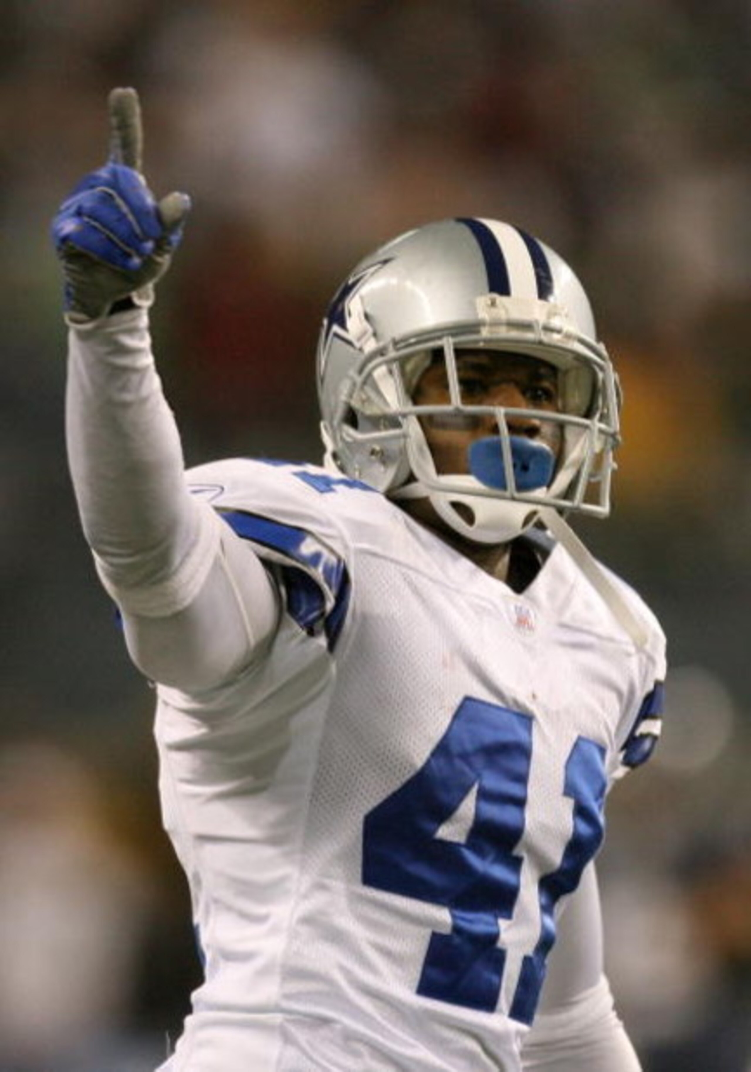SEATTLE - JANUARY 06:  Terence Newman #41 of the Dallas Cowboys reacts after tipping the ball for an interception by teammate Roy Williams #31 in the fourth quarter of the NFC Wild Card Playoff Game against the Seattle Seahawks on January 6, 2007 at Qwest