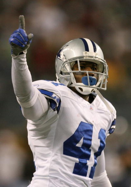 SEATTLE - JANUARY 06:  Terence Newman #41 of the Dallas Cowboys reacts after tipping the ball for an interception by teammate Roy Williams #31 in the fourth quarter of the NFC Wild Card Playoff Game against the Seattle Seahawks on January 6, 2007 at Qwest