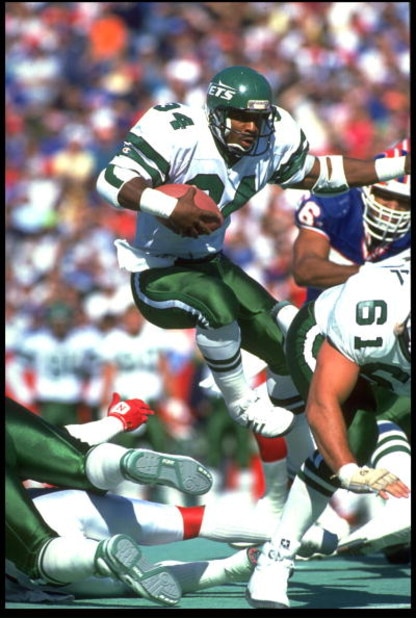 21 Oct 1991: JOHNNY HECTOR, #34, RUNNING BACK FOR THE NEW YORK JETS, LEAPS THROUGH THE LINE OF SCRIMMAGE DURING THEIR 30-27 LOSS TO THE BUFFALO BILLS AT RICH STADIUM IN ORCHARD PARK, NEW YORK.