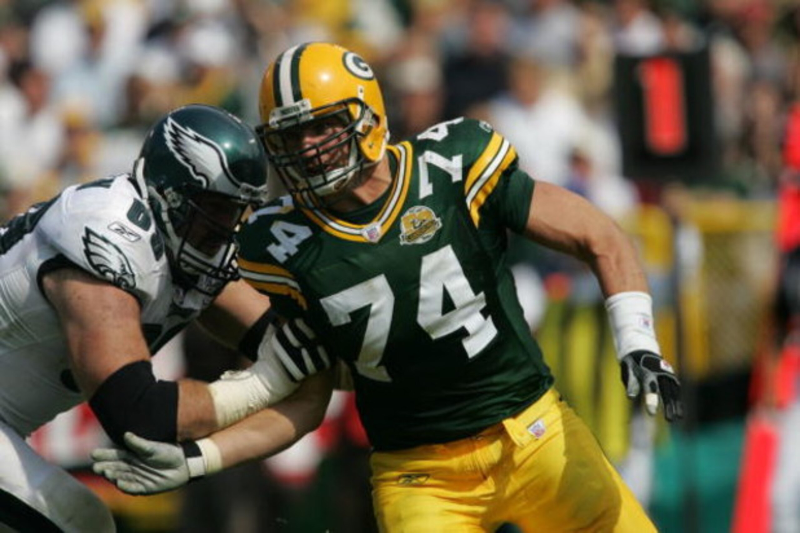 GREEN BAY, WI - SEPTEMBER 09: Aaron Kampman #74 of the Green Bay Packers rushes against Jon Runyan #69 of the Philadelphia Eagles on September 9, 2007 at Lambeau Field in Green Bay, Wisconsin. The Packers defeated the Eagles 16-13. (Photo by Jonathan Dani GREEN BAY, WI - SEPTEMBER 09: Aaron Kampman #74 of the Green Bay Packers rushes against Jon Runyan #69 of the Philadelphia Eagles on September 9, 2007 at Lambeau Field in Green Bay, Wisconsin. The Packers defeated the Eagles 16-13. (Photo by Jonathan Dani