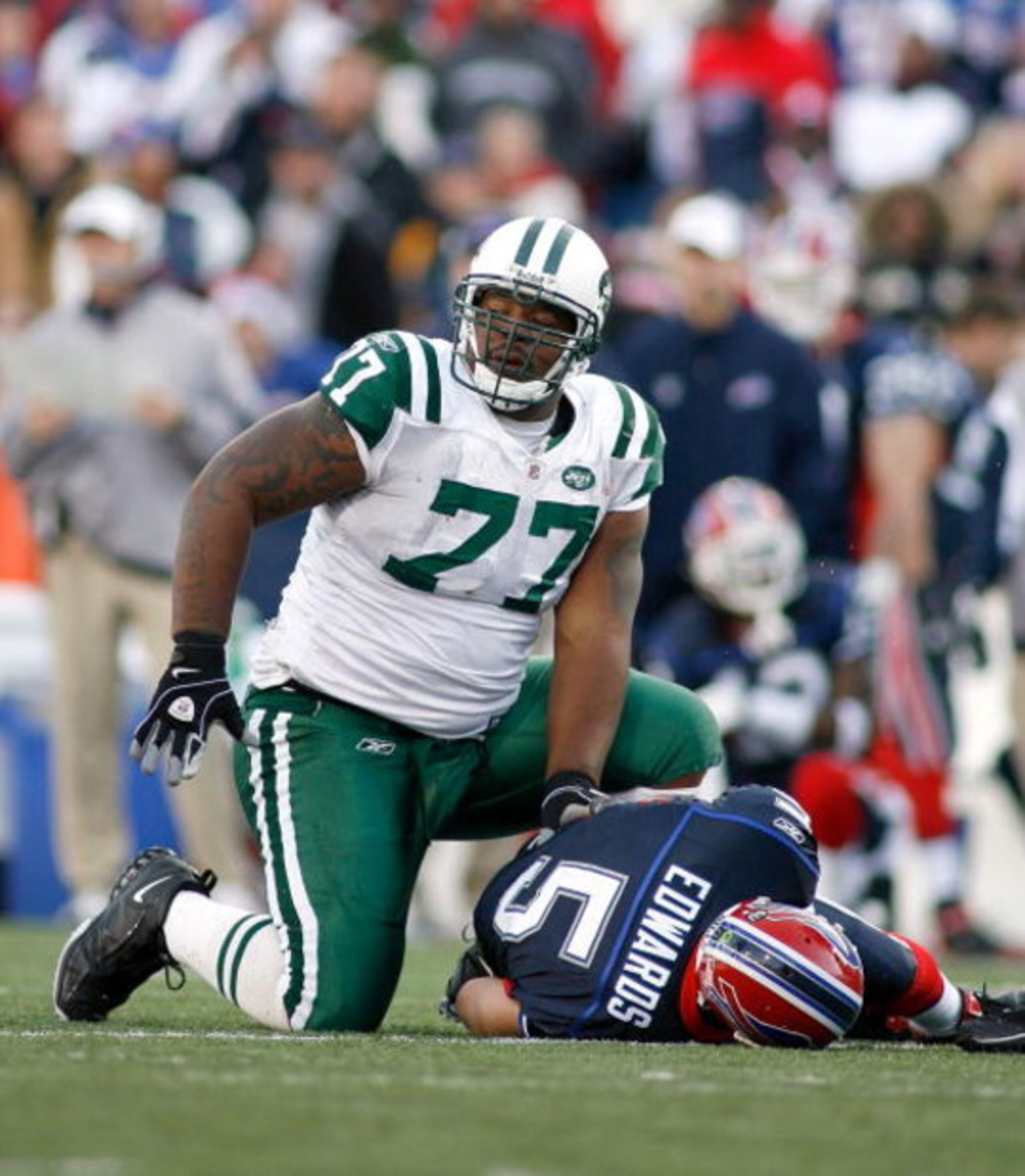 ORCHARD PARK, NY - NOVEMBER 02: Kris Jenkins #77 of the New York Jets gets up after sacking Trent Edwards #5 of the Buffalo Bills on November 2, 2008 at Ralph Wilson Stadium in Orchard Park, New York. New York won 26-17. (Photo by Rick Stewart/Getty Ima ORCHARD PARK, NY - NOVEMBER 02: Kris Jenkins #77 of the New York Jets gets up after sacking Trent Edwards #5 of the Buffalo Bills on November 2, 2008 at Ralph Wilson Stadium in Orchard Park, New York. New York won 26-17. (Photo by Rick Stewart/Getty Ima
