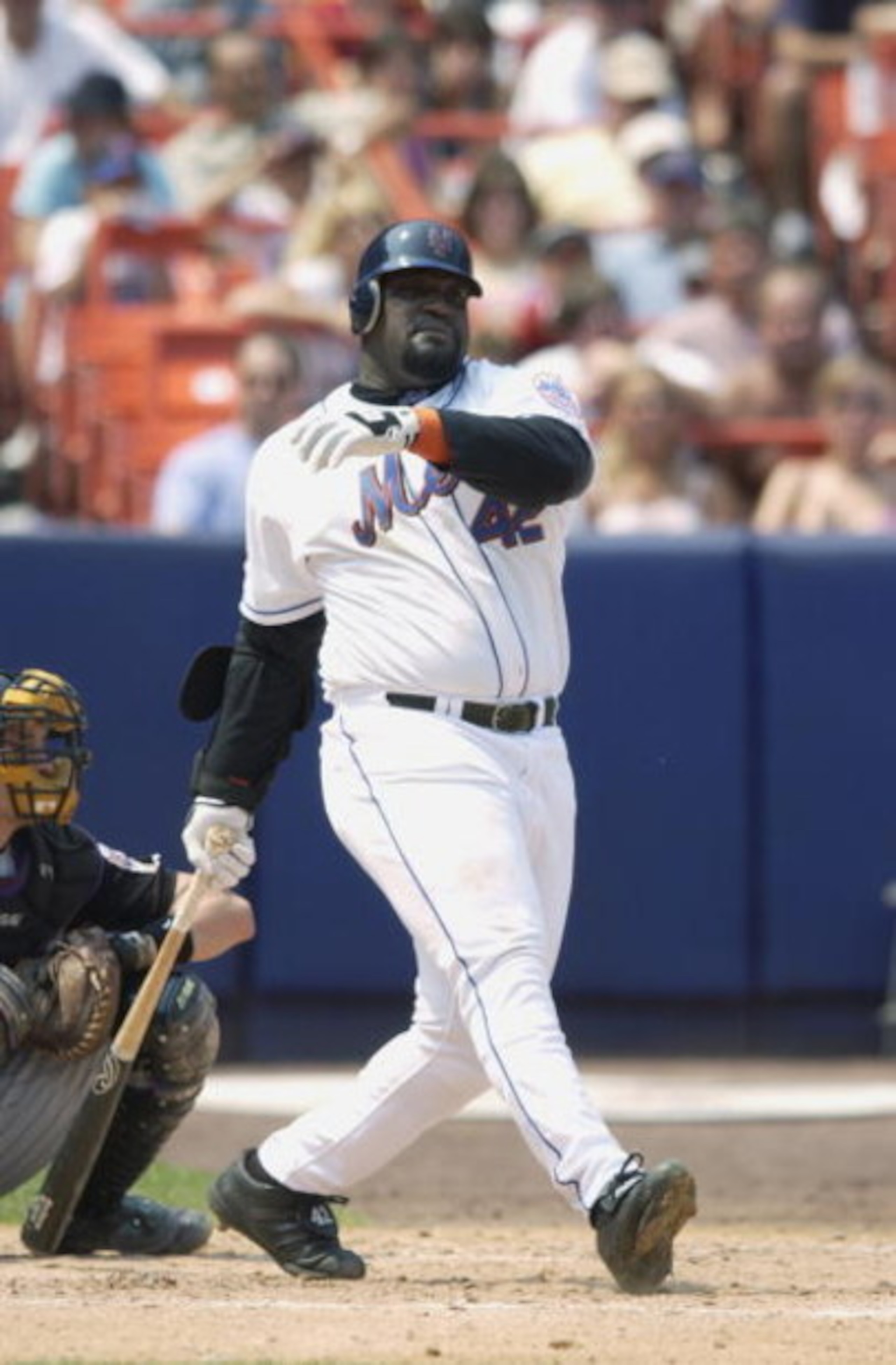 FLUSHING, NY - AUGUST 4:  First baseman Mo Vaughn #42 of the New York Mets swings at the pitch during the MLB game against the Arizona Diamondbacks on August 4, 2002 at Shea Stadium in Flushing, New York. The Diamondbacks won 12-7. (Photo by Ezra Shaw/Get