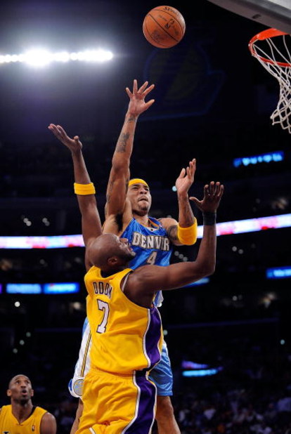 LOS ANGELES, CA - MAY 27:  Kenyon Martin #4 of the Denver Nuggets shoots over Lamar Odom #7 of the Los Angeles Lakers in Game Five of the Western Conference Finals during the 2009 NBA Playoffs at Staples Center on May 27, 2009 in Los Angeles, California. 