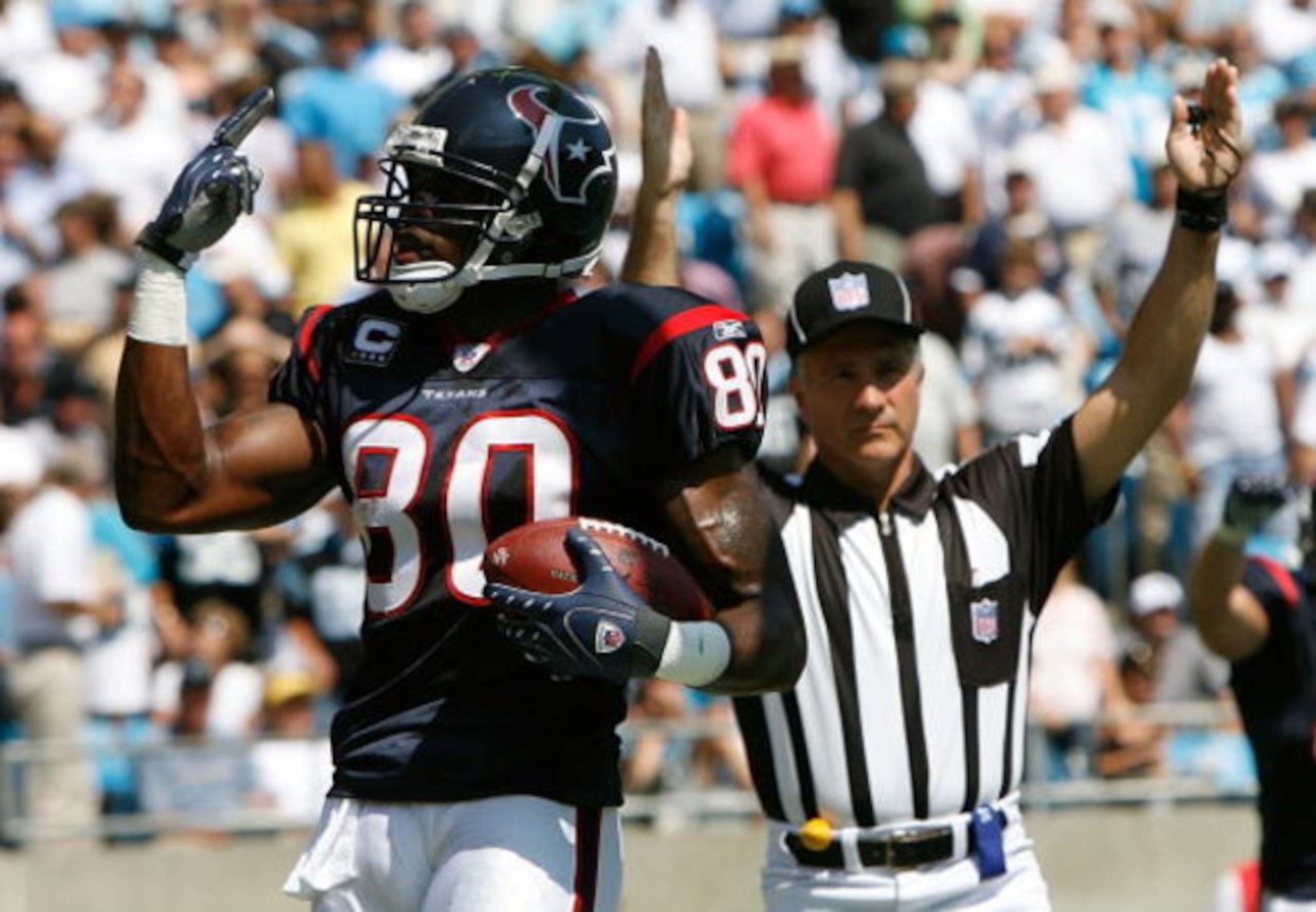 CHARLOTTE, NC - SEPTEMBER 16: Receiver Andre Johnson #80 of the Houston Texans signals to the crowd that he has two touchdowns in the first half of their 34-21 win over the Carolina Panthers at Bank of America Stadium on September 16, 2007 in Charlotte, CHARLOTTE, NC - SEPTEMBER 16: Receiver Andre Johnson #80 of the Houston Texans signals to the crowd that he has two touchdowns in the first half of their 34-21 win over the Carolina Panthers at Bank of America Stadium on September 16, 2007 in Charlotte,