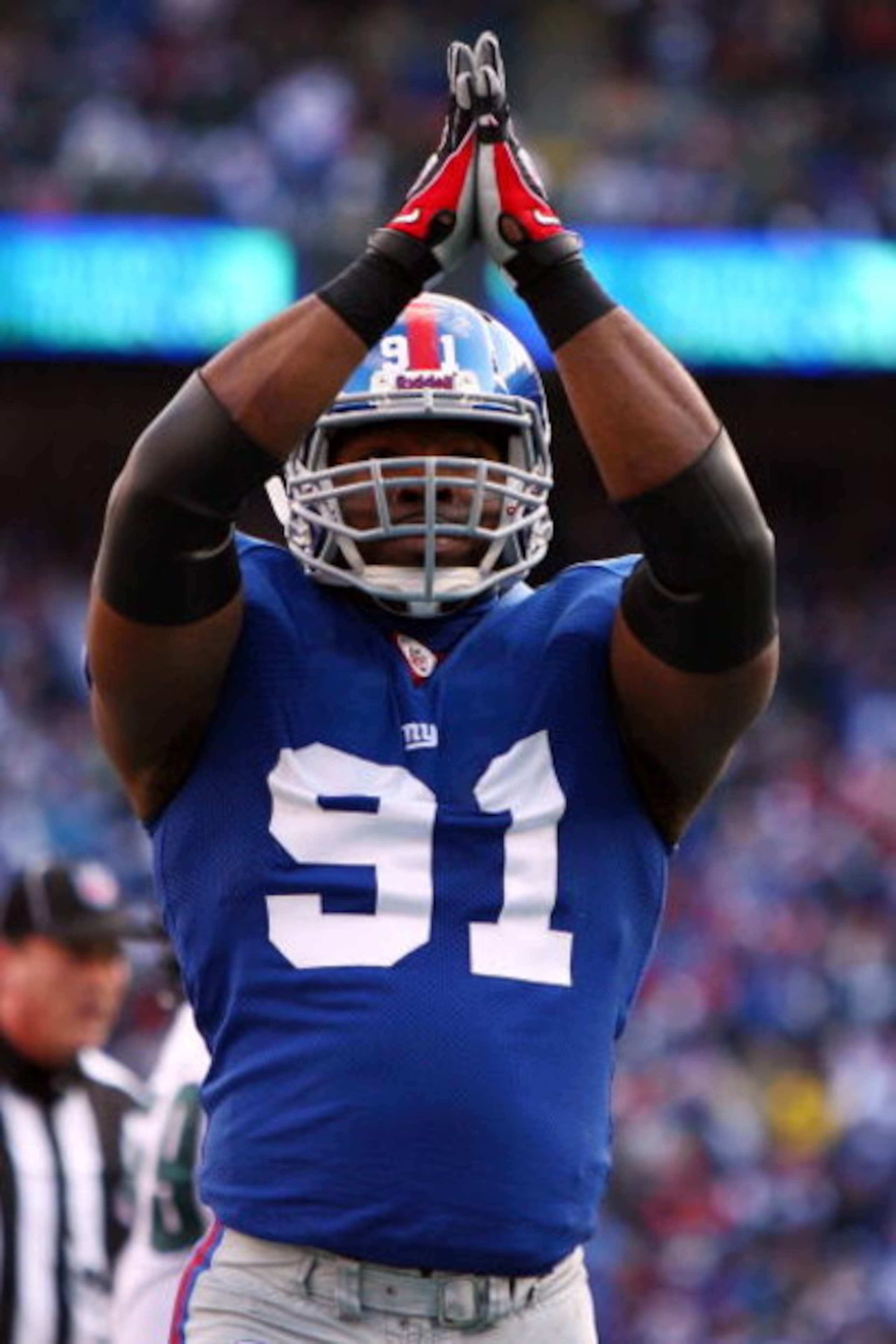 EAST RUTHERFORD, NJ - JANUARY 11: Justin Tuck #91 of the New York Giants reacts after a saftey against the Philadelphia Eagles during the NFC Divisional Playoff Game on January 11, 2009 at Giants Stadium in East Rutherford, New Jersey. (Photo by Al Bell EAST RUTHERFORD, NJ - JANUARY 11: Justin Tuck #91 of the New York Giants reacts after a saftey against the Philadelphia Eagles during the NFC Divisional Playoff Game on January 11, 2009 at Giants Stadium in East Rutherford, New Jersey. (Photo by Al Bell