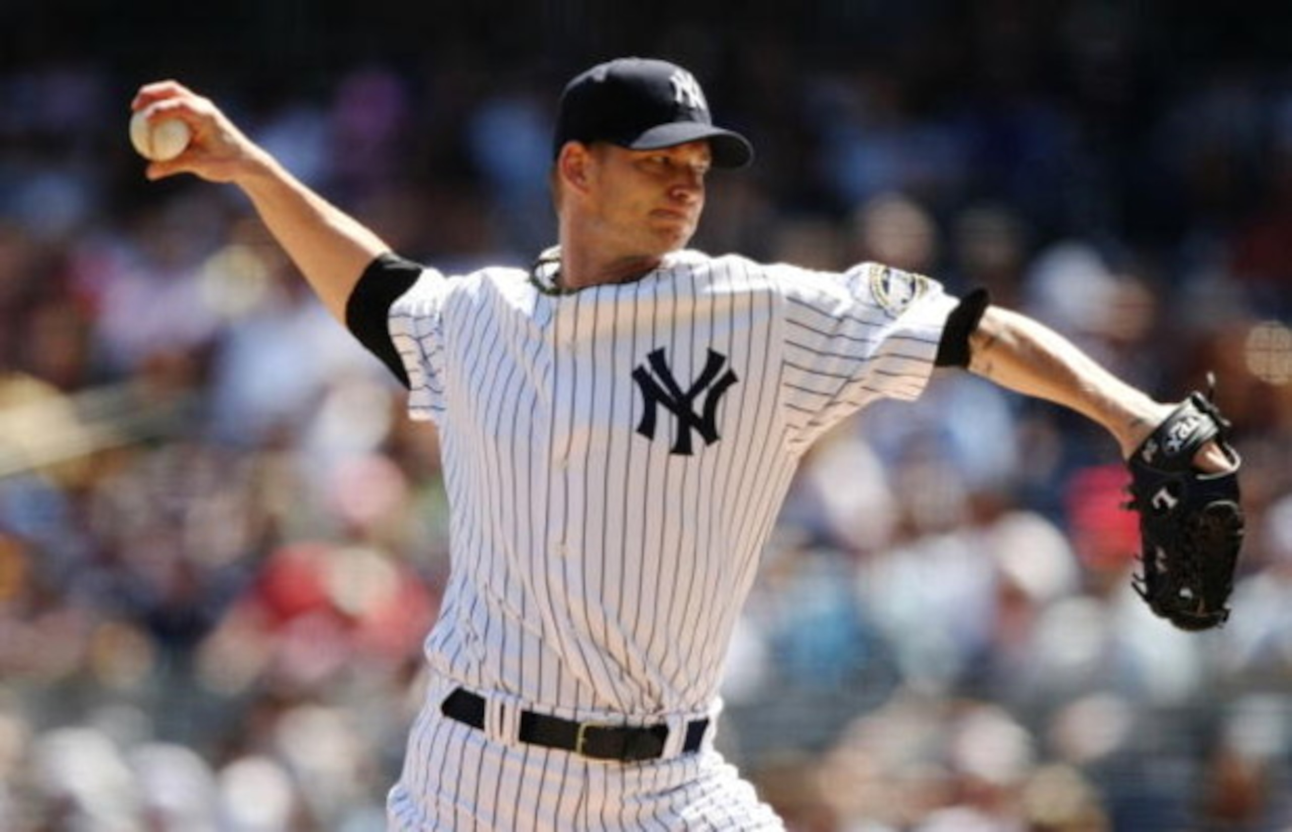 NEW YORK - AUGUST 27: Pitcher A.J. Burnett #34 of the New York Yankees throws a pitch against the Texas Rangers during the MLB game on August 27, 2009 at Yankees Stadium in the Bronx borough of New York City. (Photo by Al Bello/Getty Images) NEW YORK - AUGUST 27: Pitcher A.J. Burnett #34 of the New York Yankees throws a pitch against the Texas Rangers during the MLB game on August 27, 2009 at Yankees Stadium in the Bronx borough of New York City. (Photo by Al Bello/Getty Images)