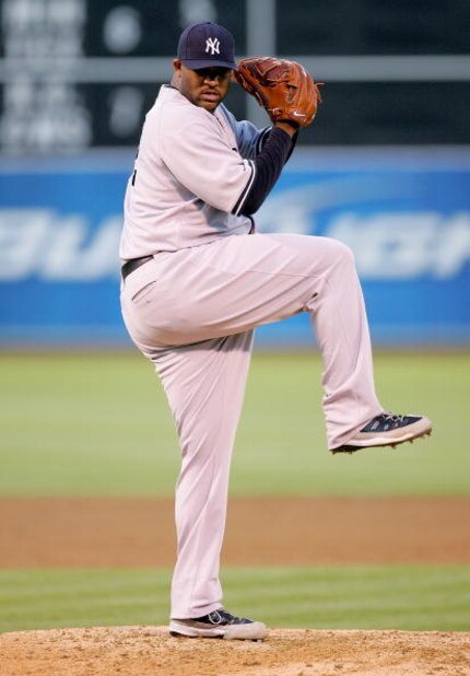 OAKLAND, CA - AUGUST 18:  CC Sabathia #52 of the New York Yankees pitches against the Oakland Athletics during their game at the Oakland Coliseum on August 18, 2009 in Oakland, California.  (Photo by Ezra Shaw/Getty Images)