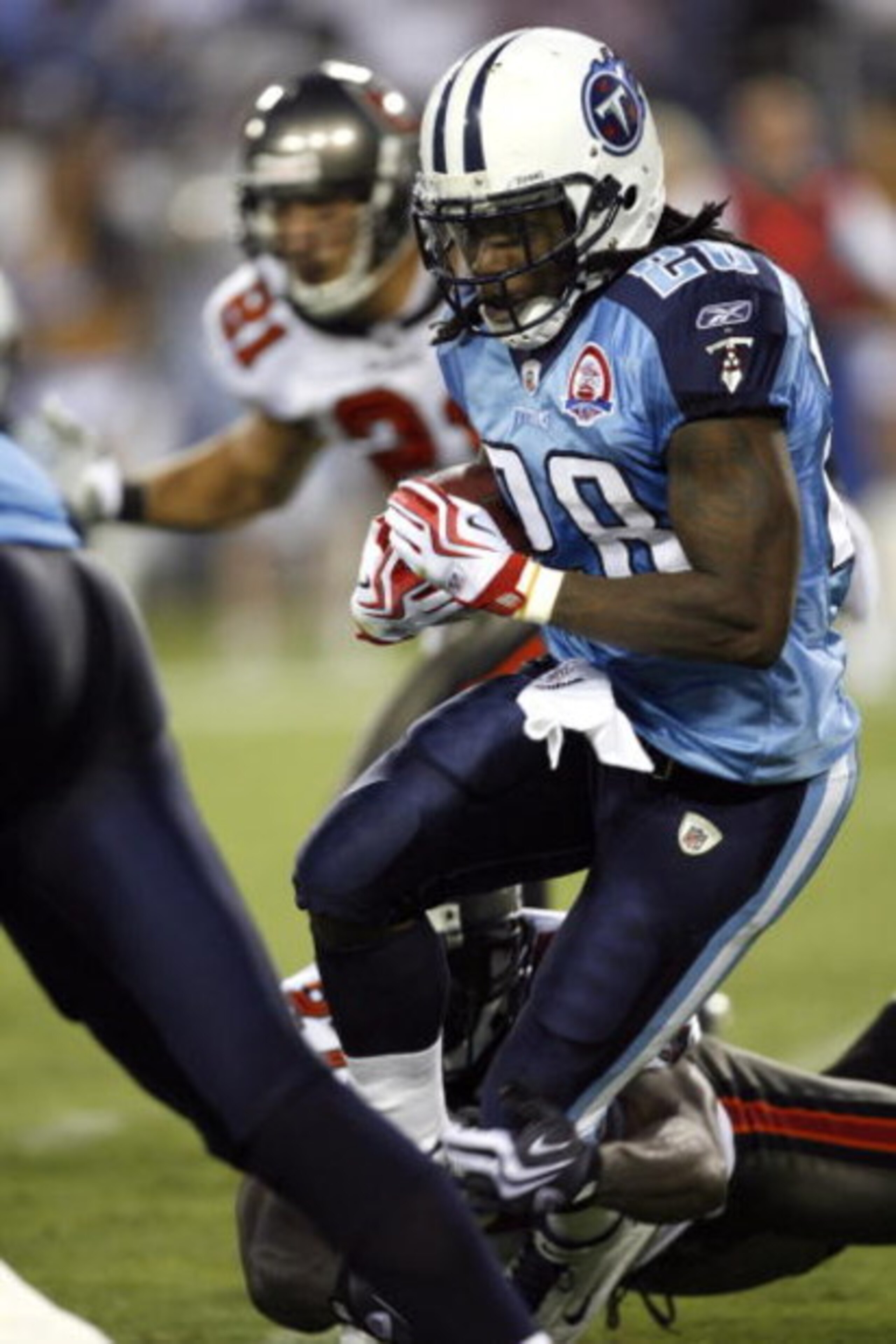 NASHVILLE, TN - AUGUST 15: Chris Johnson #28 of the Tennessee Titans runs with the ball against the Tampa Bay Buccaneers during a preseason NFL game at LP Field on August 15, 2009 in Nashville, Tennessee. The Titans beat the Buccaneers 27-20. (Photo by Jo