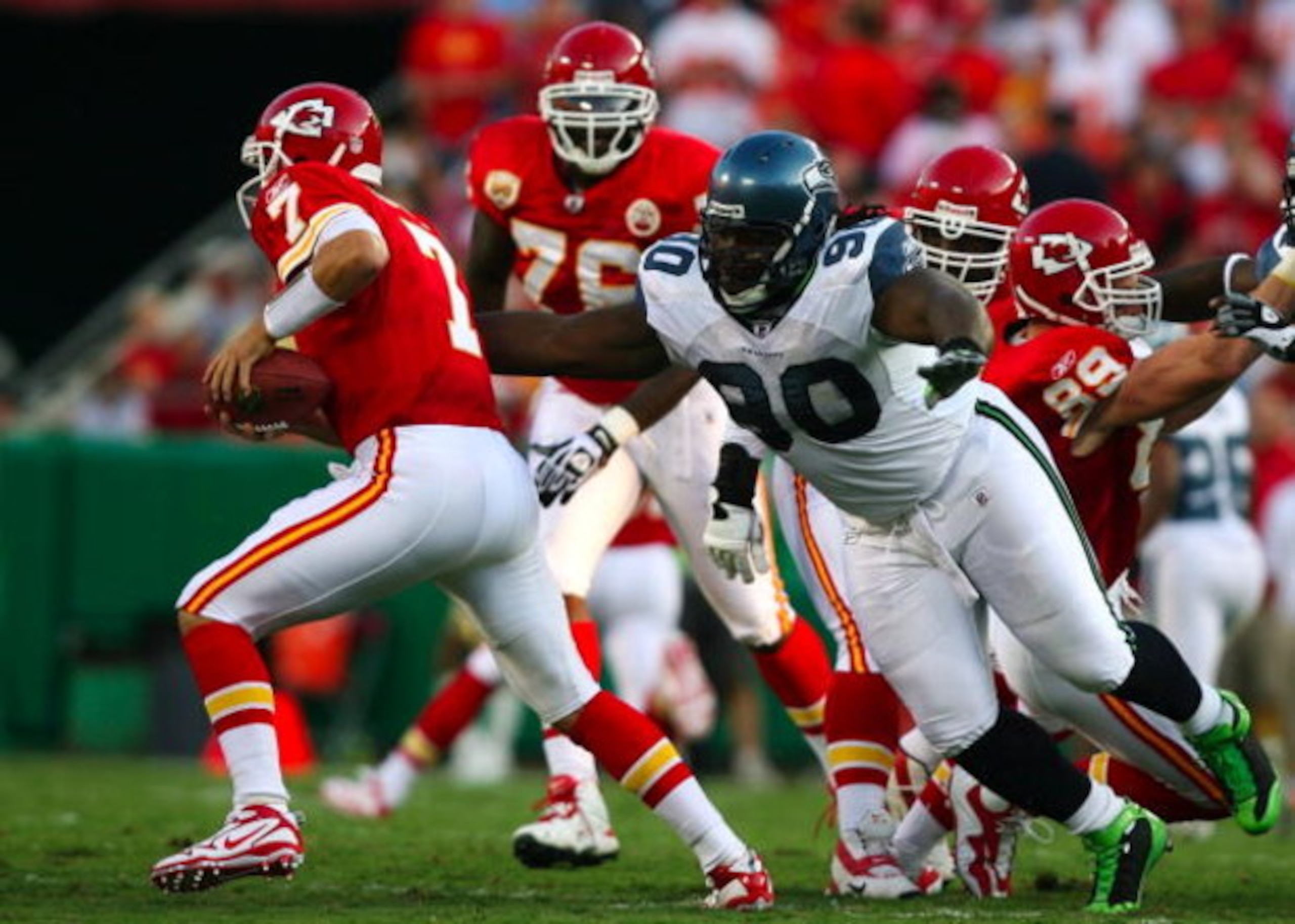 KANSAS CITY, MO - AUGUST 29: Quarterback Matt Cassel #7 of the Kansas City Chiefs is pressured by Colin Cole #90 of the Seattle Seahawks during their preseason game at Arrowhead Stadium on August 29, 2009 in Kansas City, Missouri. (Photo by Dilip Vishwana