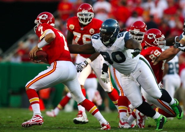 KANSAS CITY, MO - AUGUST 29: Quarterback Matt Cassel #7 of the Kansas City Chiefs is pressured by Colin Cole #90 of the Seattle Seahawks during their preseason game at Arrowhead Stadium on August 29, 2009 in Kansas City, Missouri. (Photo by Dilip Vishwana