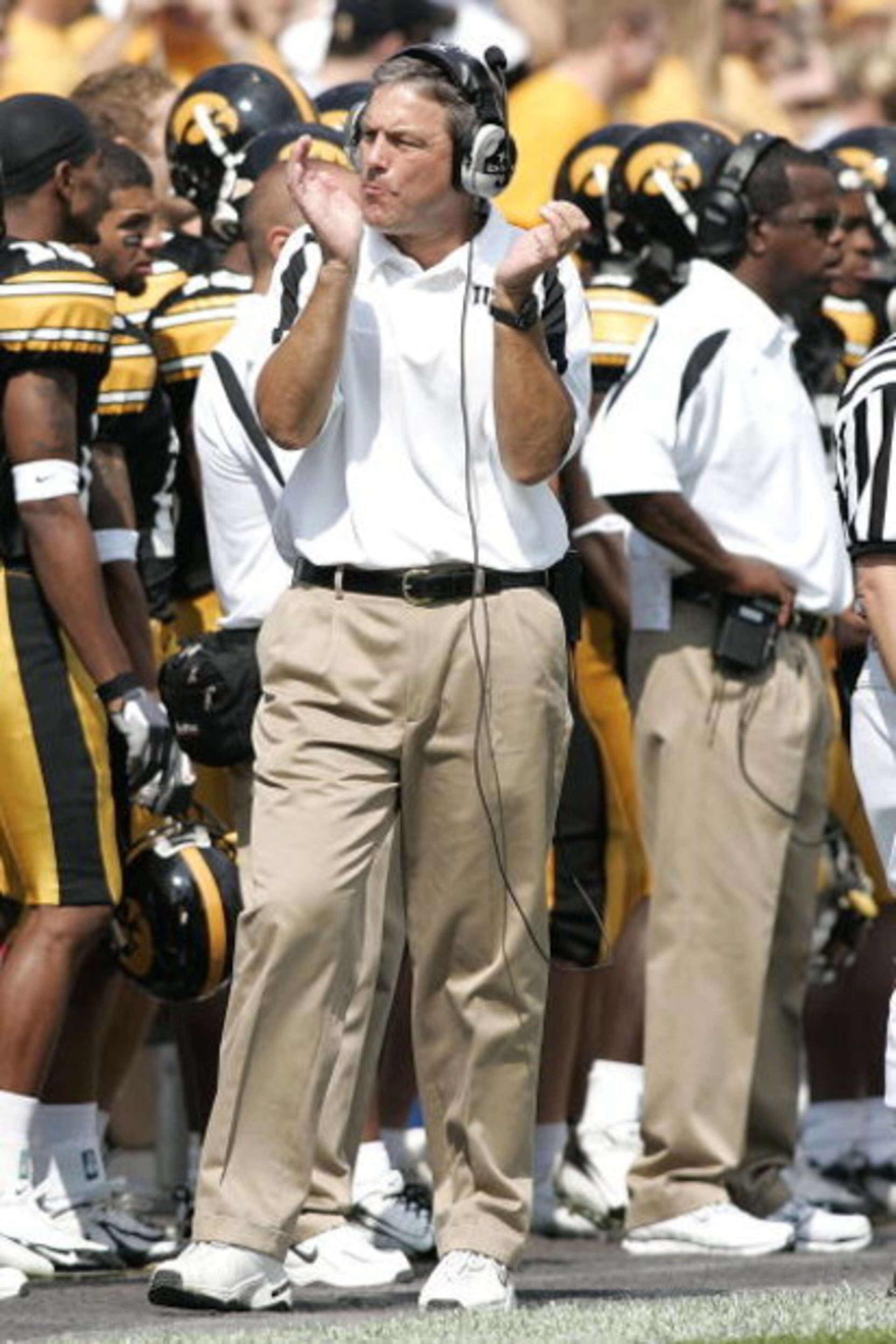 IOWA CITY, IA - SEPTEMBER 16: Head coach Kirk Ferentz of the Iowa Hawkeyes reacts after a touchdown by clapping  against the Iowa State Cyclones at Kinnick Stadium on September 16, 2006 in Iowa City, Iowa. The Hawkeyes defeated Cyclones 27-17. (Photo by S