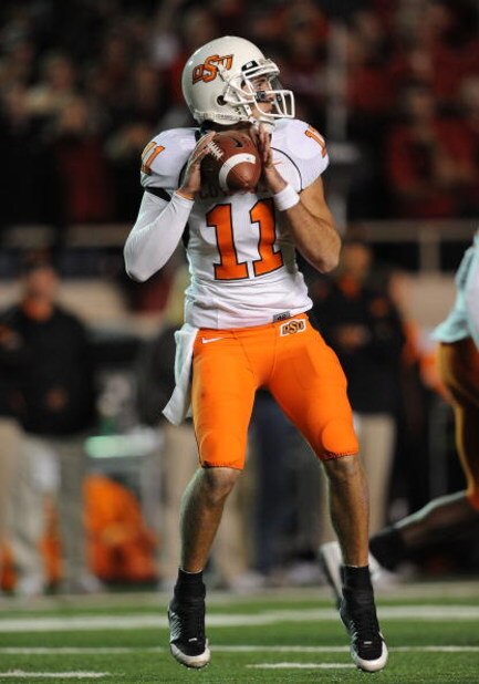 LUBBOCK, TX - NOVEMBER 08:  Quarterback Zac Robinson #11 of the Oklahoma State Cowboys during play against the Texas Tech Red Raiders at Jones AT&T Stadium on November 8, 2008 in Lubbock, Texas.  (Photo by Ronald Martinez/Getty Images)