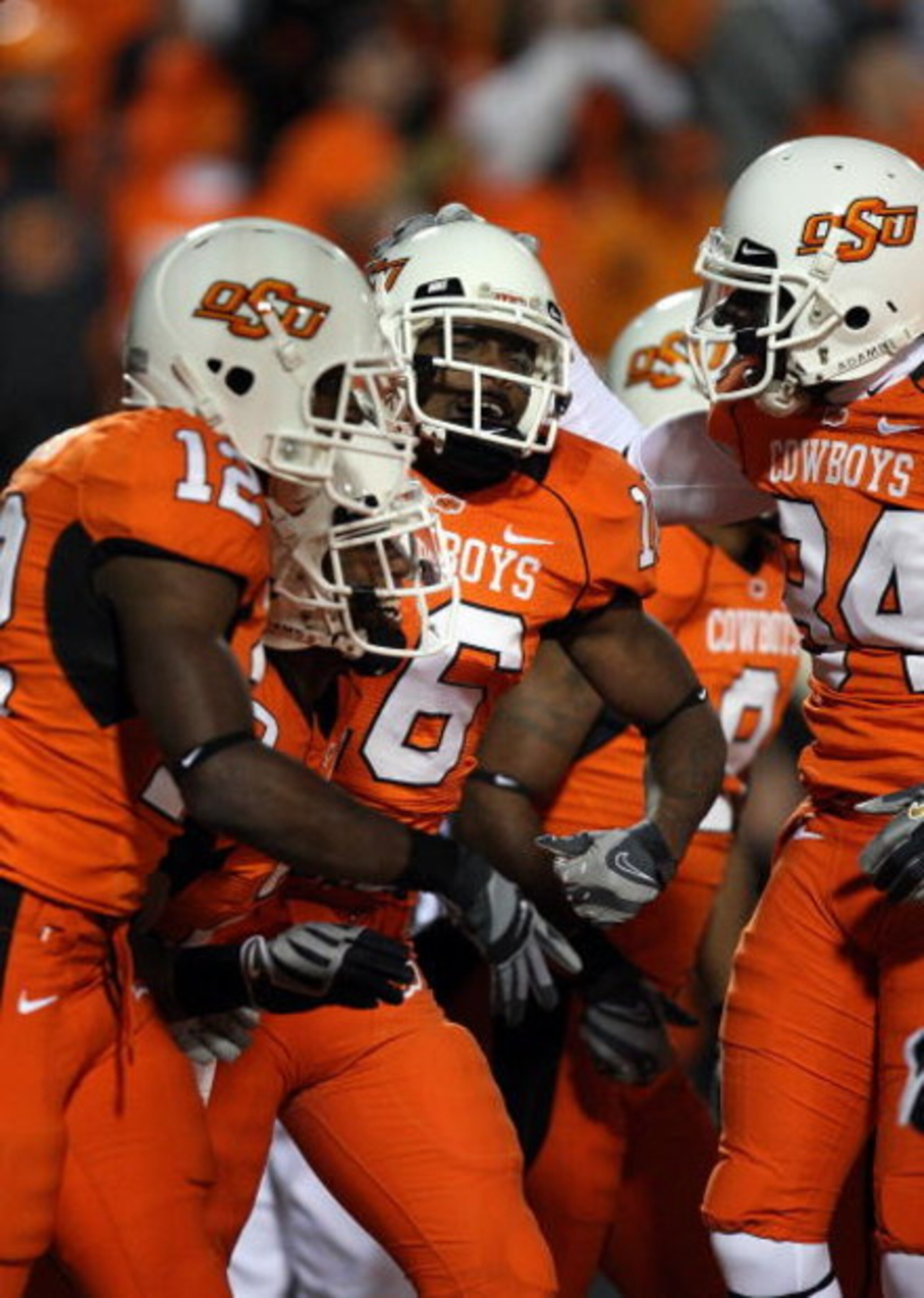STILLWATER, OK - NOVEMBER 29:  Perrish Cox #16 of the Oklahoma State Cowboys celebrates a 90-yard kickoff touchdown return against the Oklahoma Sooners at Boone Pickens Stadium on November 29, 2008 in Stillwater, Oklahoma.  (Photo by Ronald Martinez/Getty
