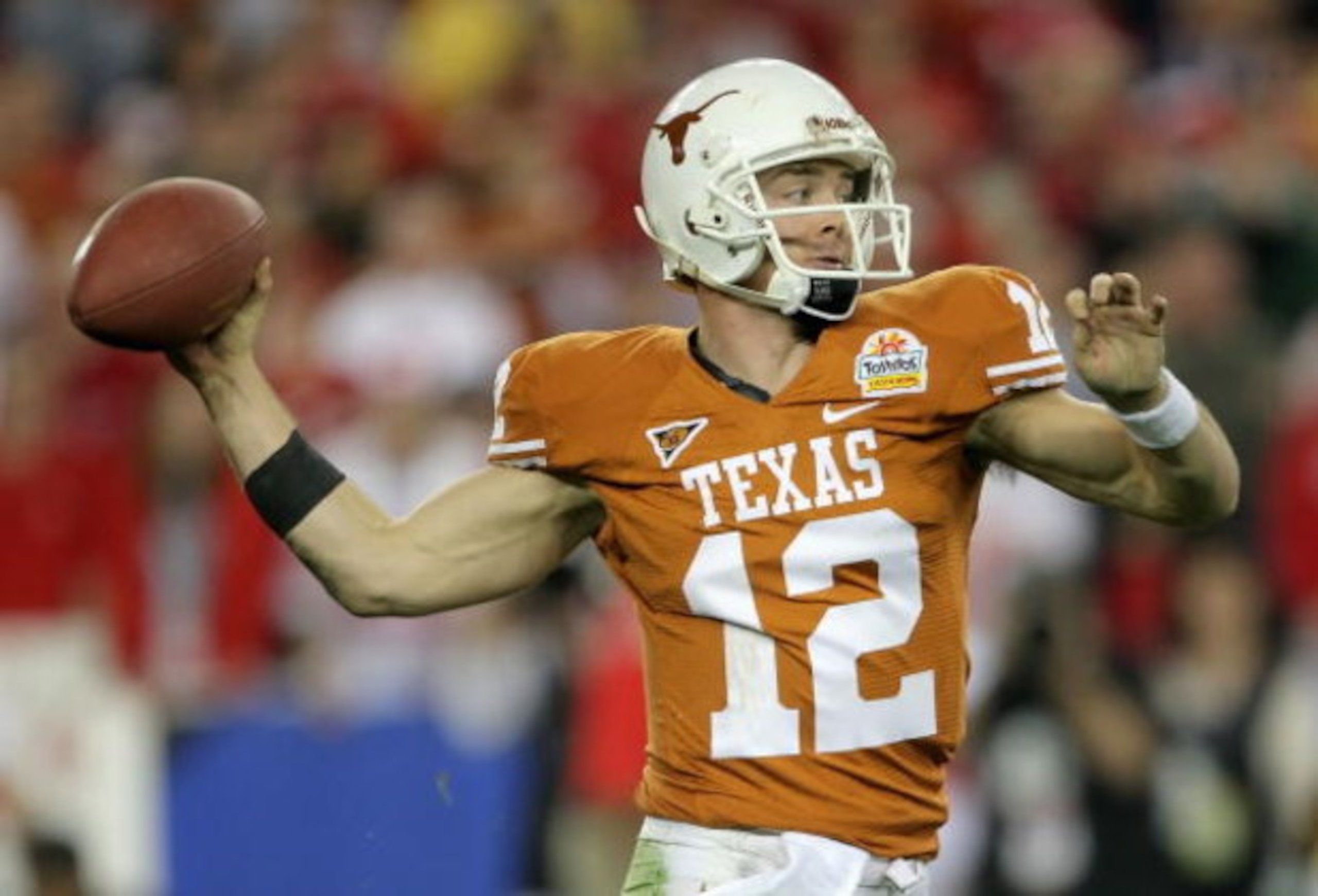 GLENDALE, AZ - JANUARY 05:  Quarterback Colt McCoy #12 of the Texas Longhorns drops back to pass during the Tostitos Fiesta Bowl Game against the Ohio State Buckeyes on January 5, 2009 at University of Phoenix Stadium in Glendale, Arizona.  (Photo by Doug
