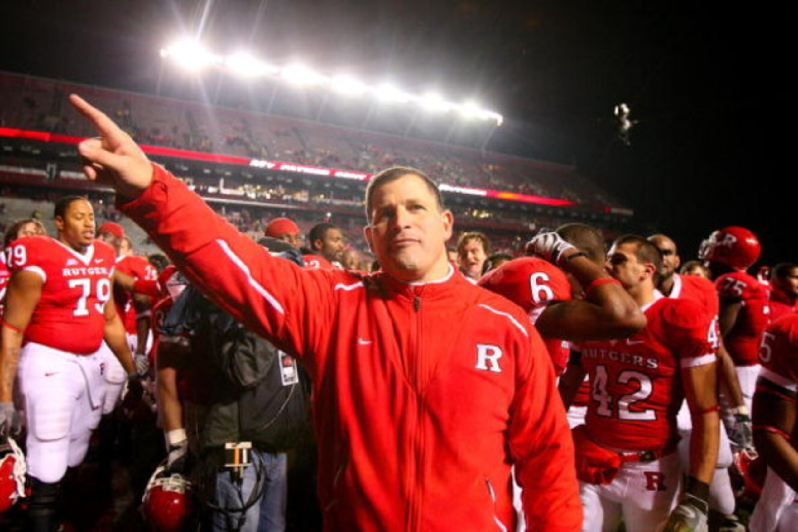PISCATAWAY, NJ - DECEMBER 04:  Greg Schiano head coach of the Rutgers Scarlet Knights celebrates victory over the Louisville Cardinals at Rutgers Stadium on December 4, 2008 in Piscataway, New Jersey.  (Photo by Jim McIsaac/Getty Images)